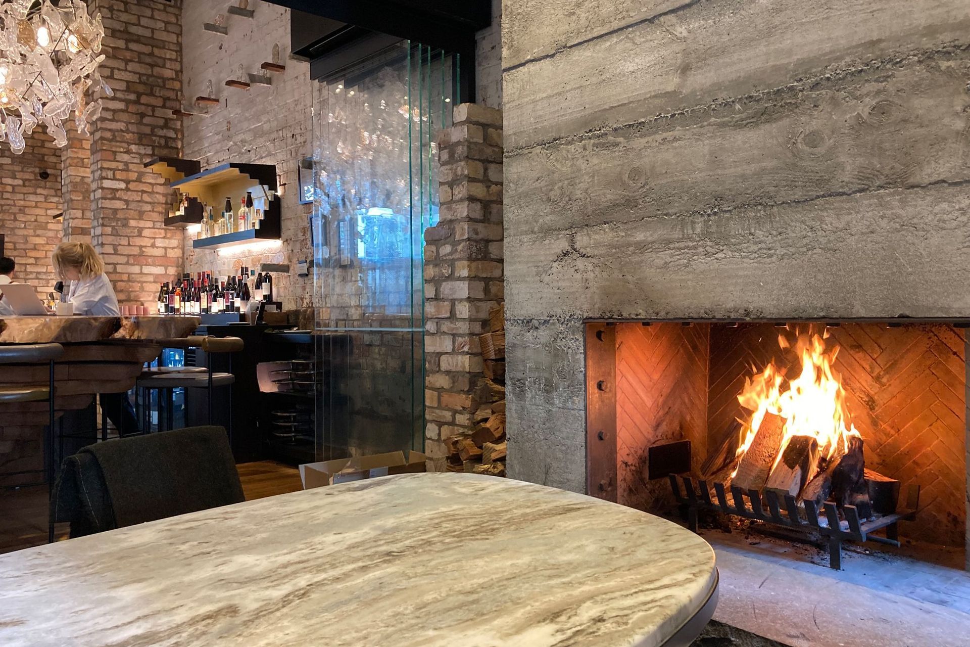 Warmington Traditional Corner Open Wood Fireplace with herringbone brick pattern