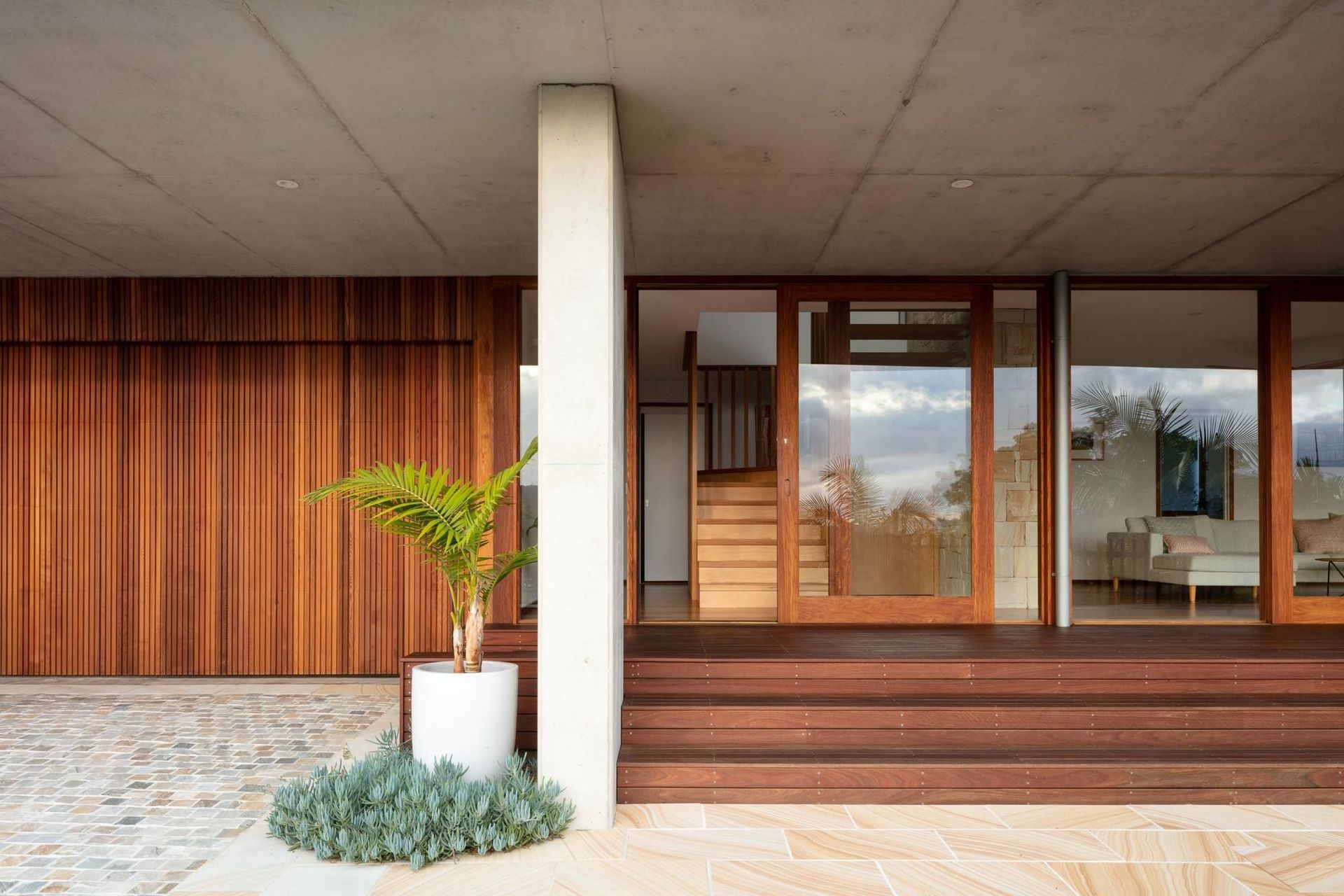 05-Matt-Day-Architect-Matt-Day-Bayview-House-Entry-Timber-Deck-Timber-Cladding-Sandstone-Pavers-Concrete-Column.jpg