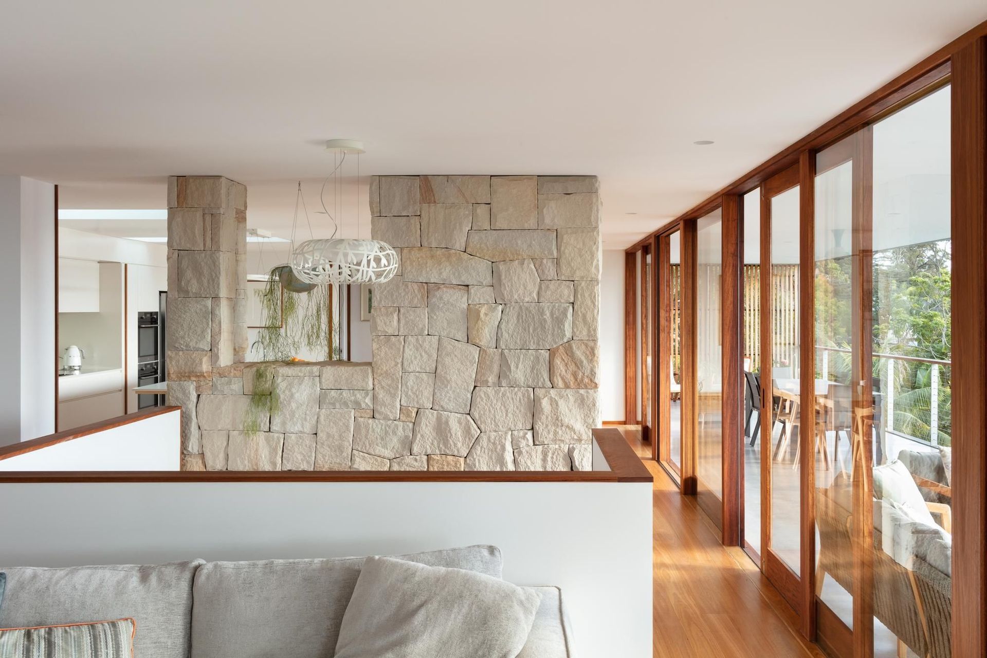 07-Matt-Day-Architect-Matt-Day-Bayview-House-Living-Sandstone-Wall-Timber-Sliding-Doors.jpg