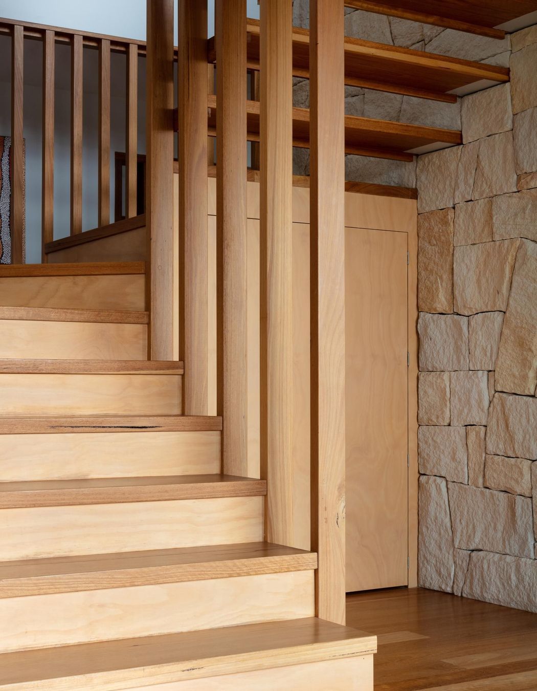 14-Matt-Day-Architect-Matt-Day-Bayview-House-Stair-Timber-Battens-Sandstone-Wall-Timber-Floor.jpg