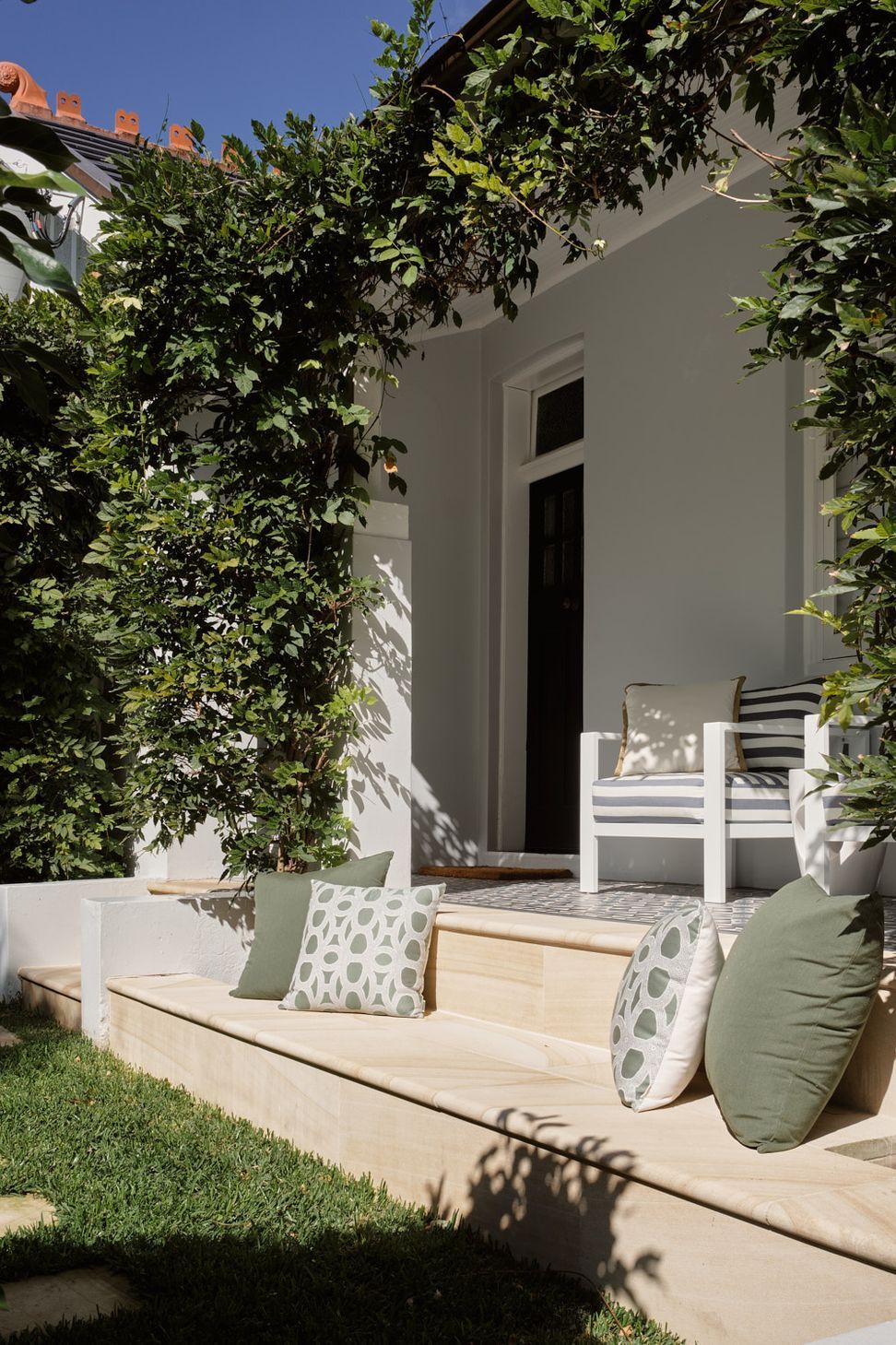 Addition of the stone bench completes the repurpose of the green space on the northern elevation of the dwelling.
