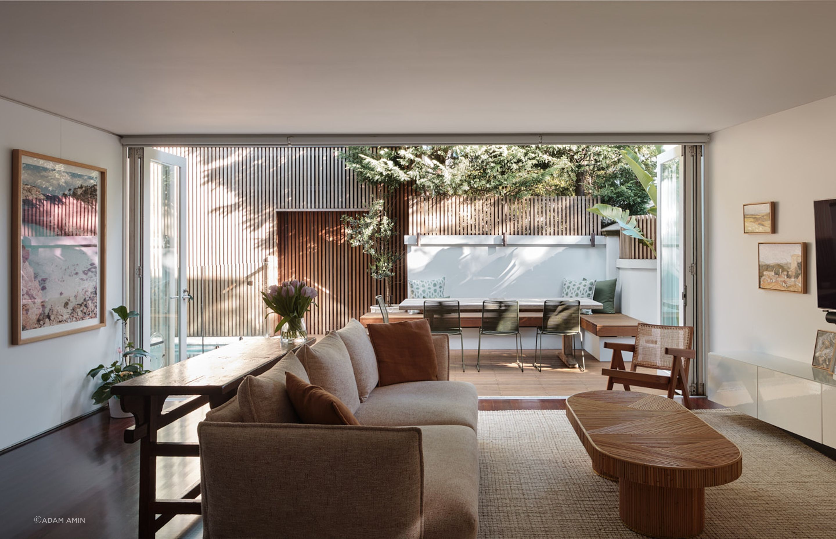 The indoor living space is connected to the outdoor entertaining space via double bi-fold doors.