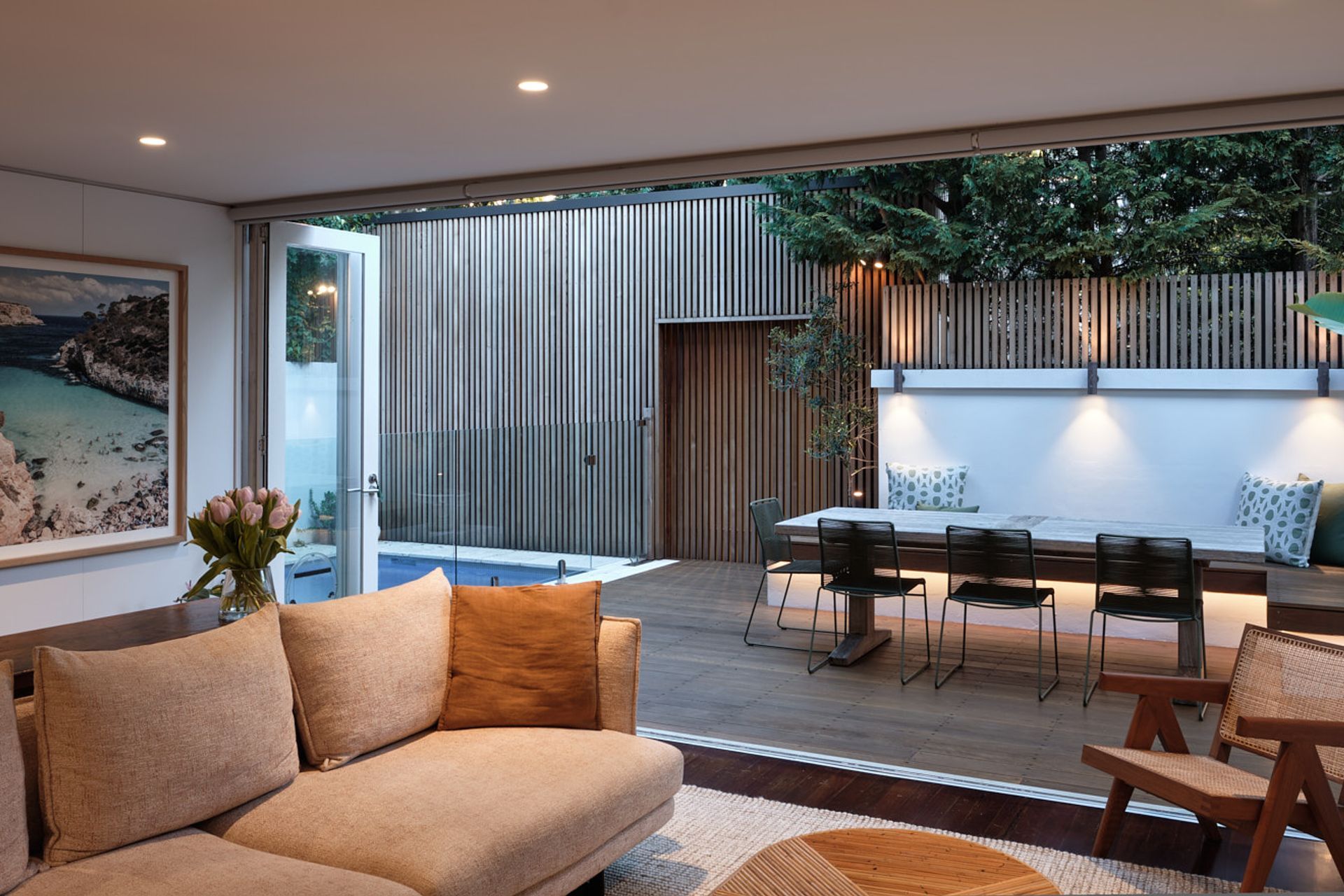 Careful lighting design elevates the mood of the outdoor entertaining area for evening events.