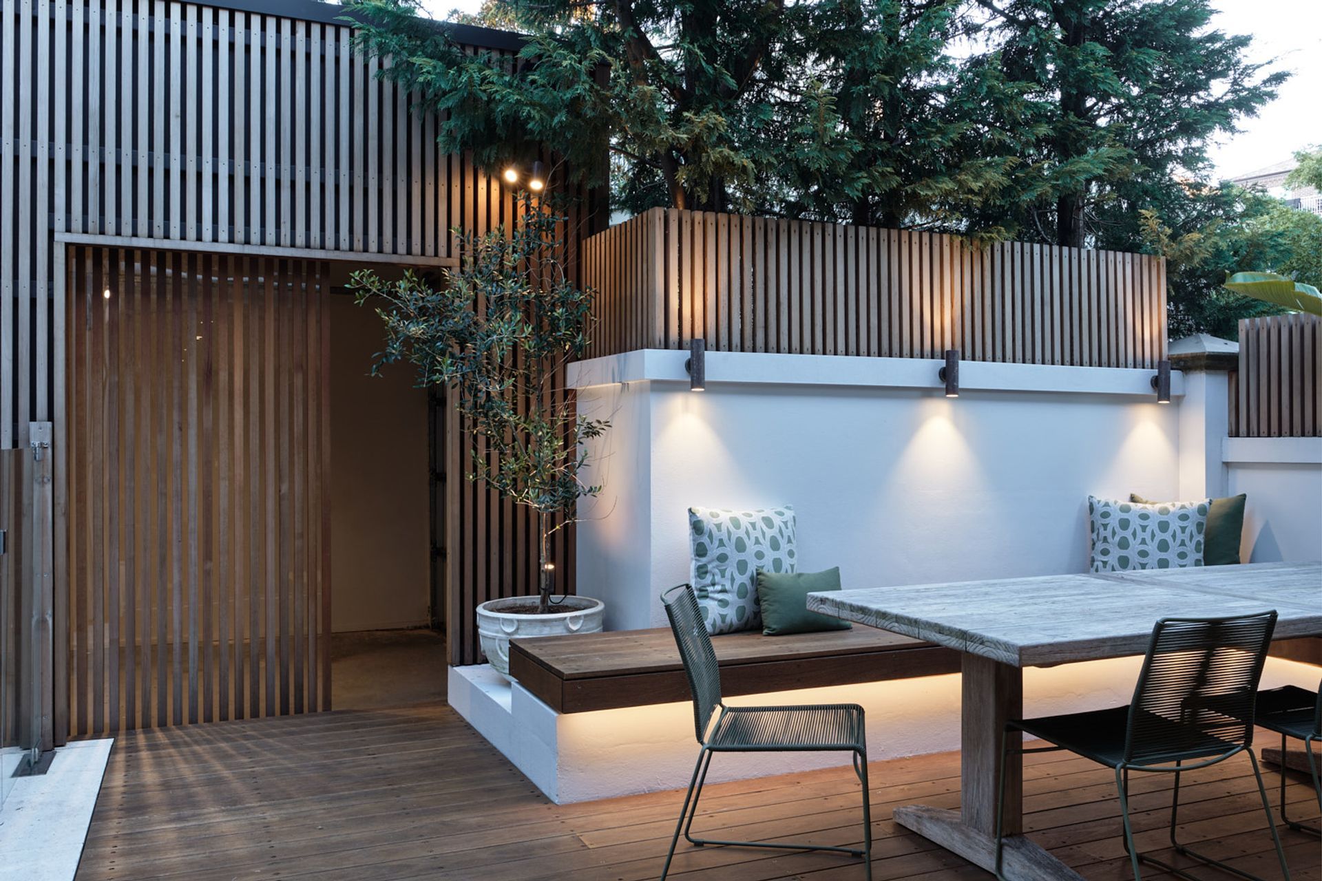 Through the use of perspex, light from inside the garage is able to penetrate through, giving life in an otherwise dark corner.