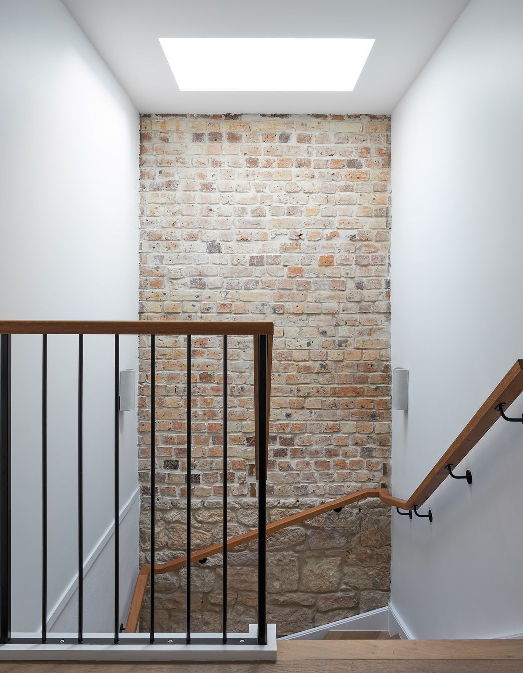 Previous home occupants have left a timestamp through layering various materials used during the respective construction periods. These have been celebrated, making centrepieces and visual interests of the home.