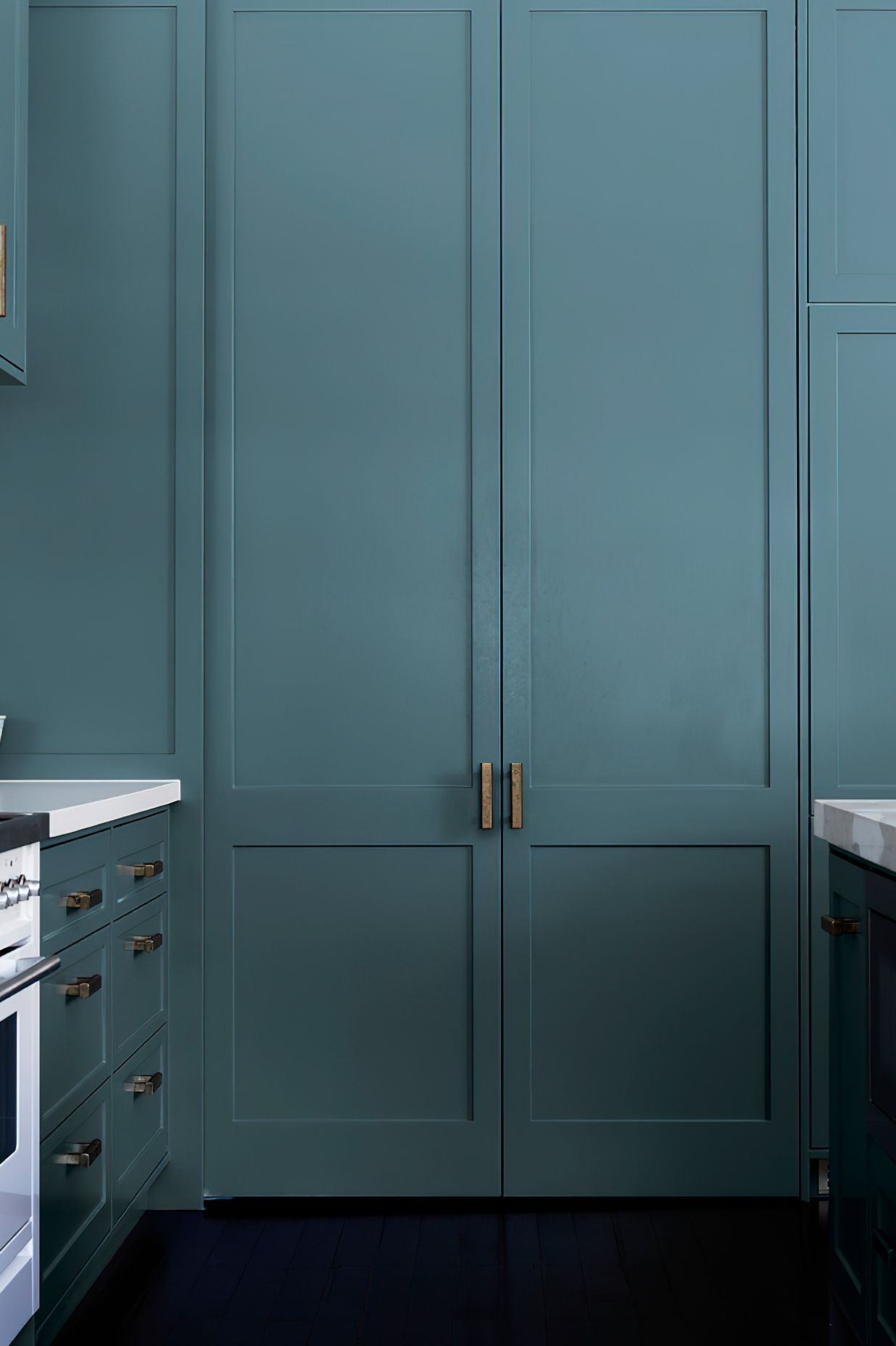 BLUE GREY PANTRY - The large pantry offers loads of storage, and with a few clever tricks, it maximises functionality. One door slides, the other swings, and to make life even easier, a sensor light turns on when the doors are opened.