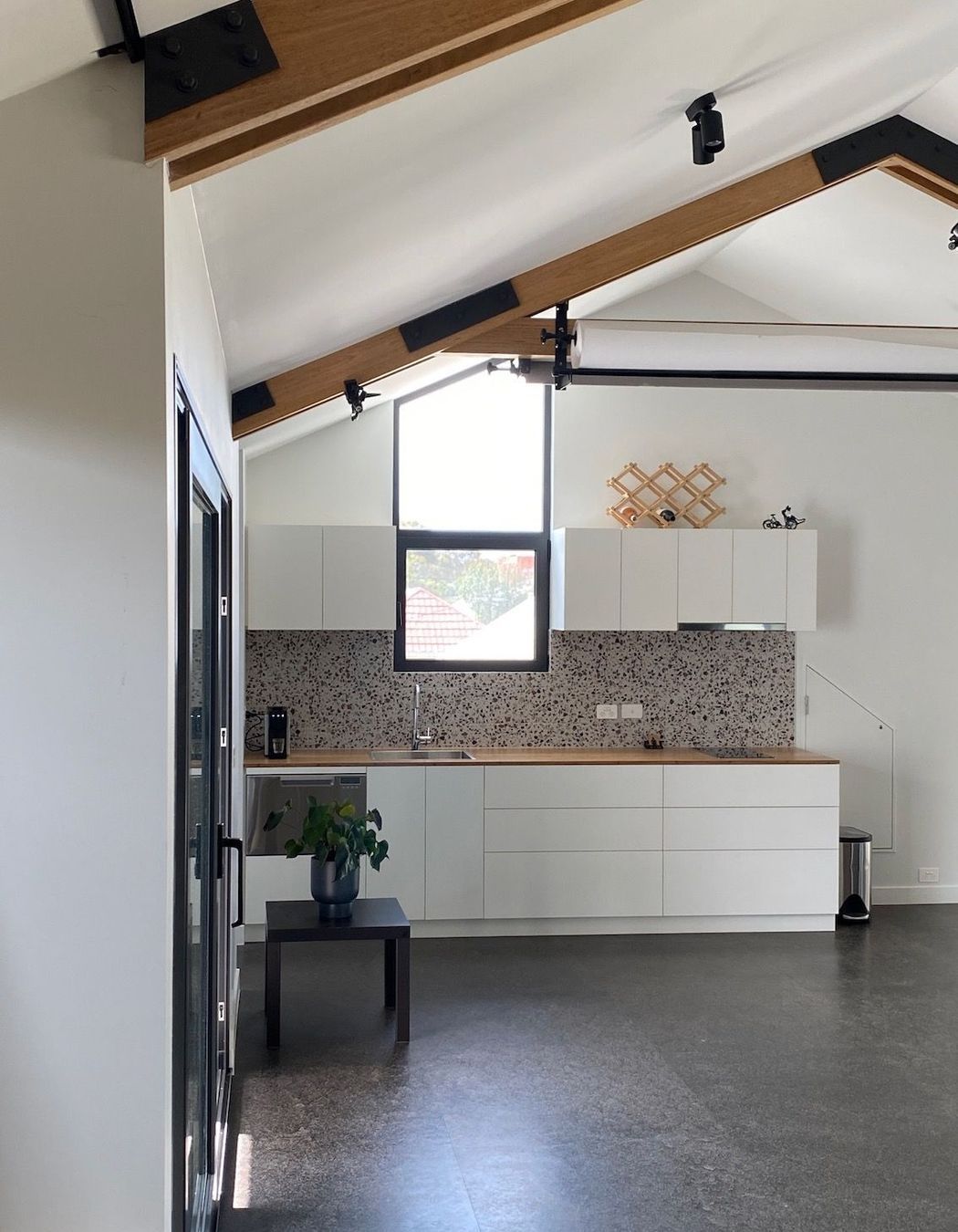 Kitchen with exposed timber trusses