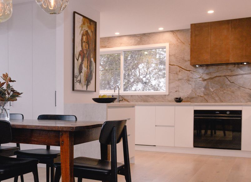 Renovated Kitchen with Coastal Views and Refined Material Palette