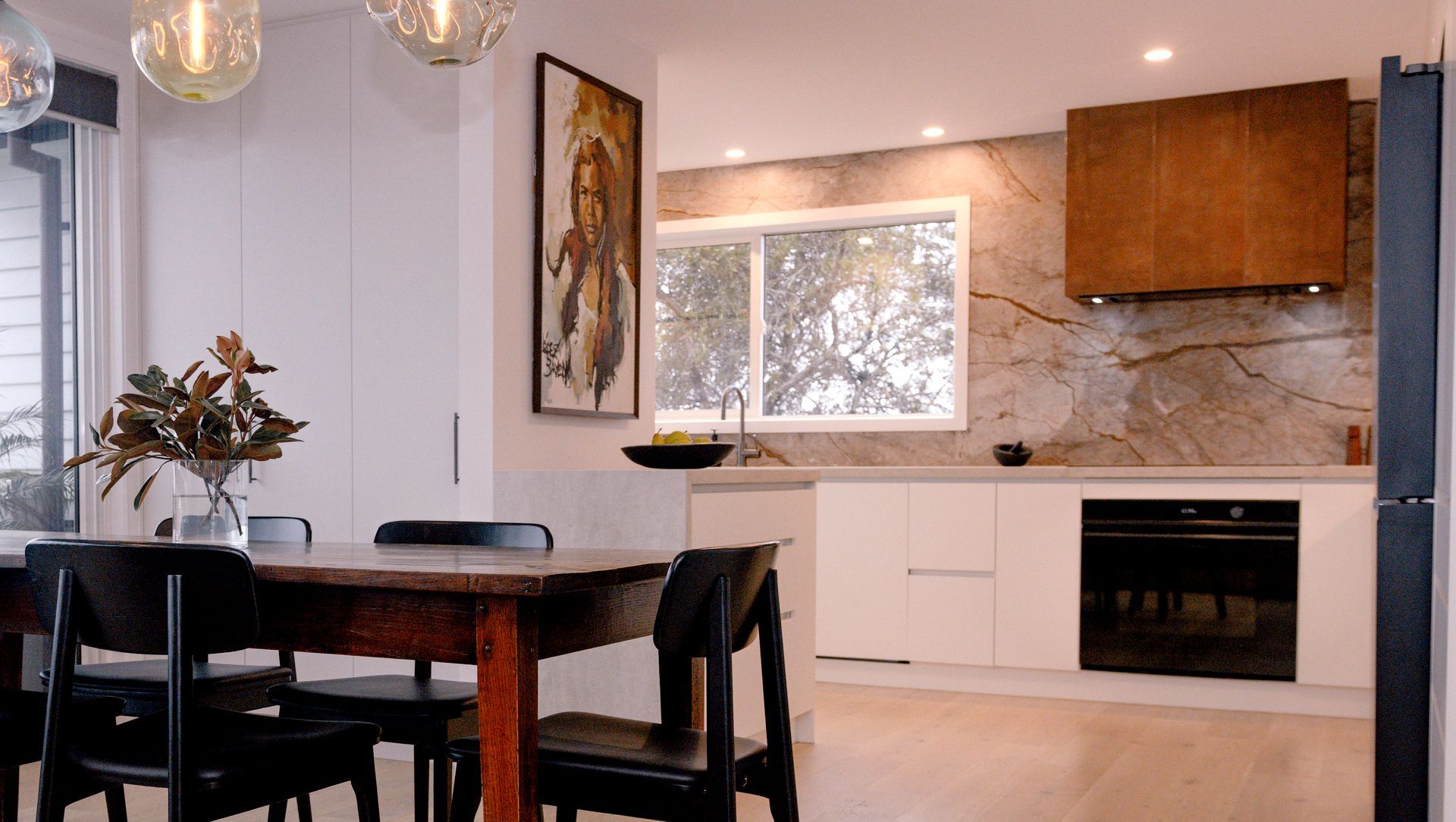 Renovated Kitchen with Coastal Views and Refined Material Palette banner