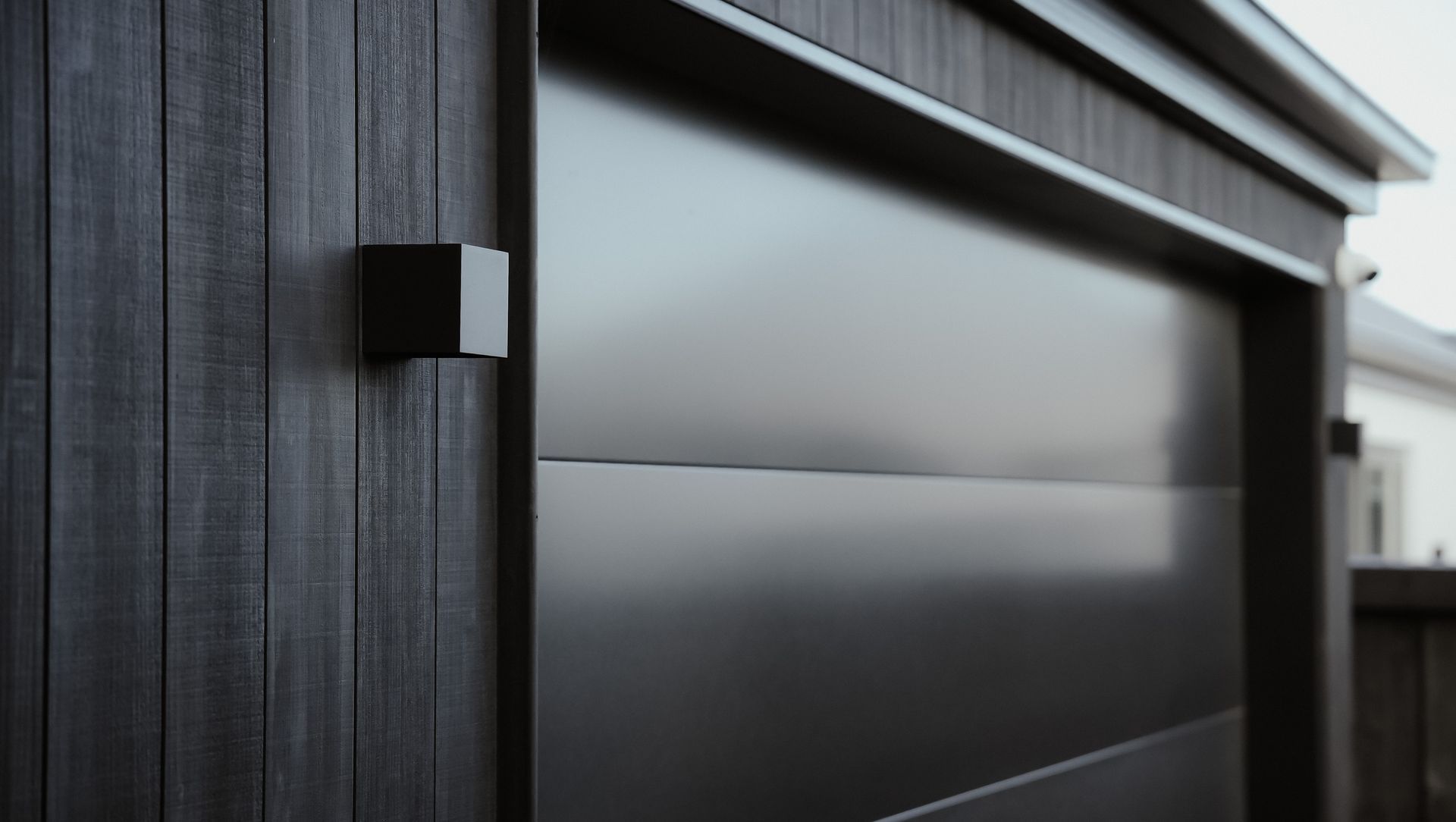 Halswell Project 01 | Smooth Flat Panel Sectional Door banner