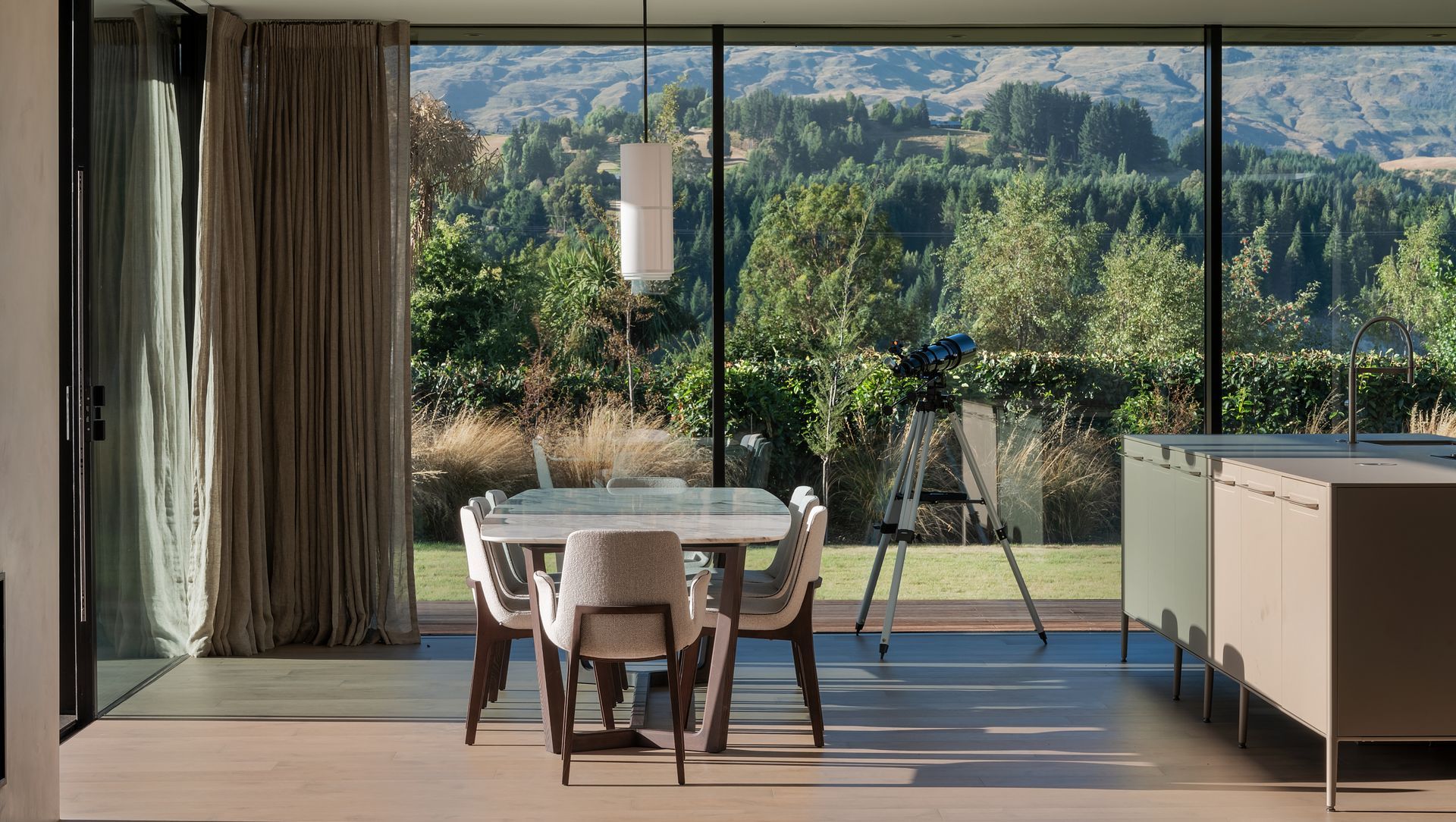 Dining room views to Coronet Peak.  Featuring Poliform dining table and chairs from Studio Italia, Forte flooring oak floors.