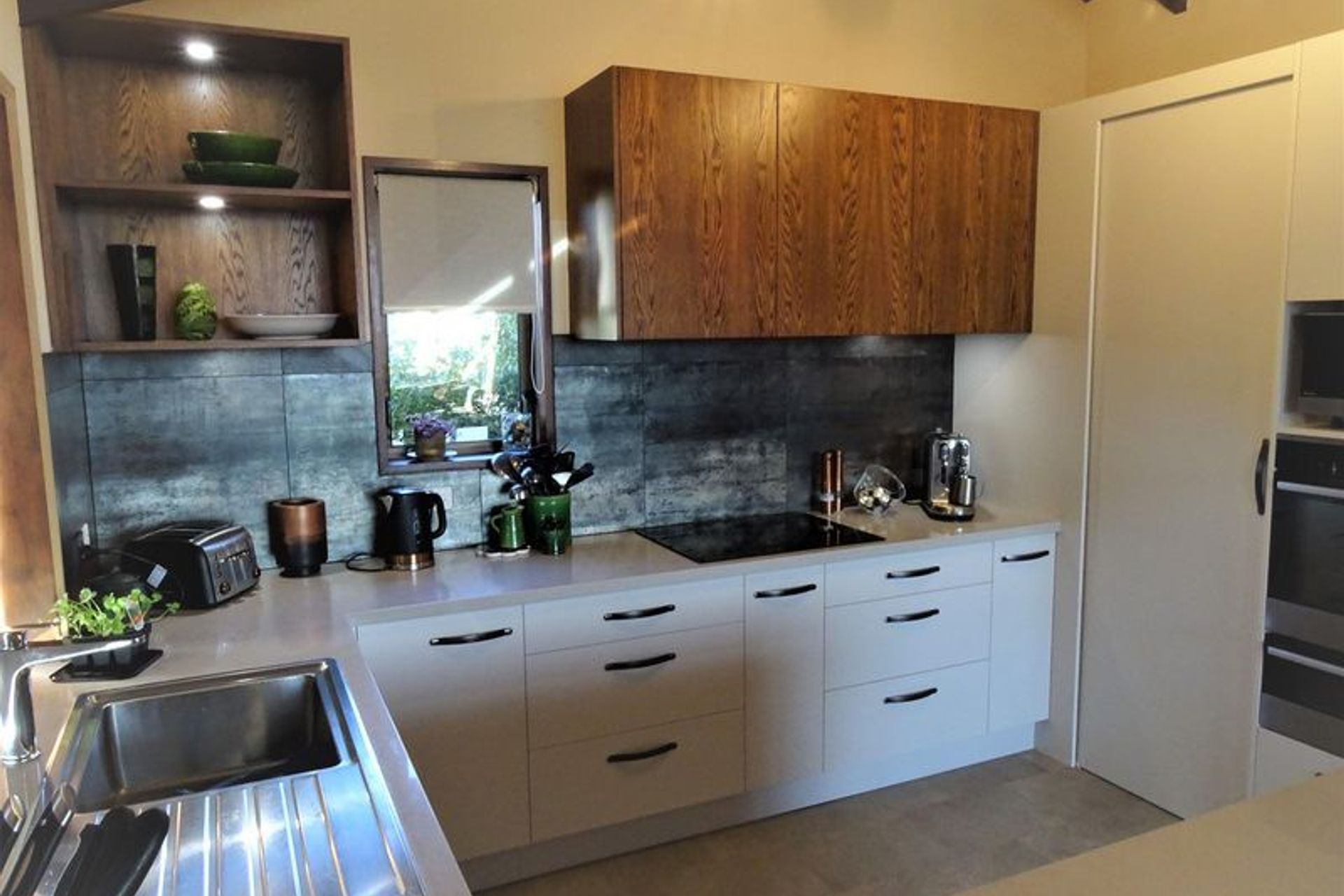 Different style drawers adding interest and storage to this kitchen design in Dunedin