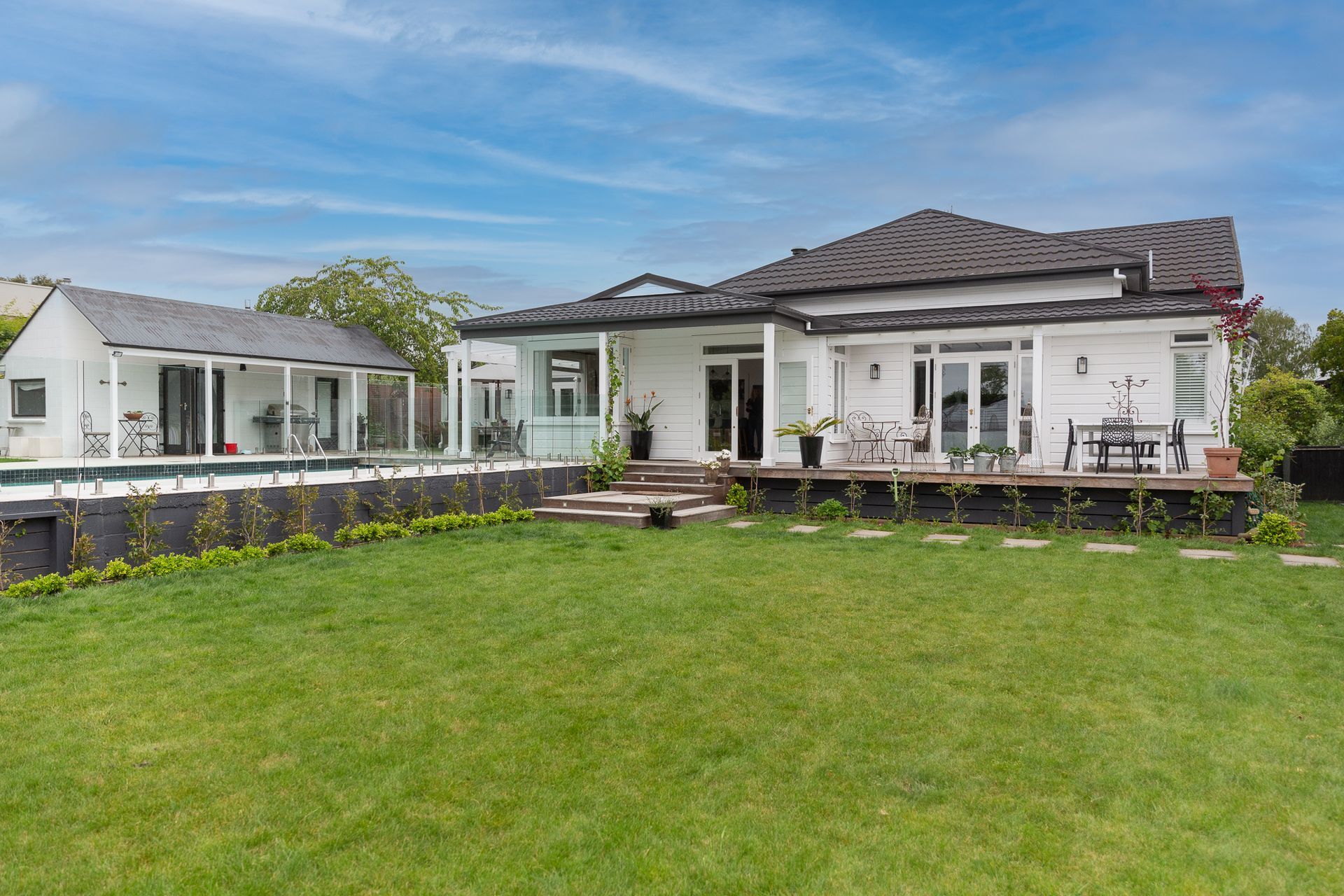 The exterior doors on this project look peacefully down on the gardens allowing access from all areas of the home
