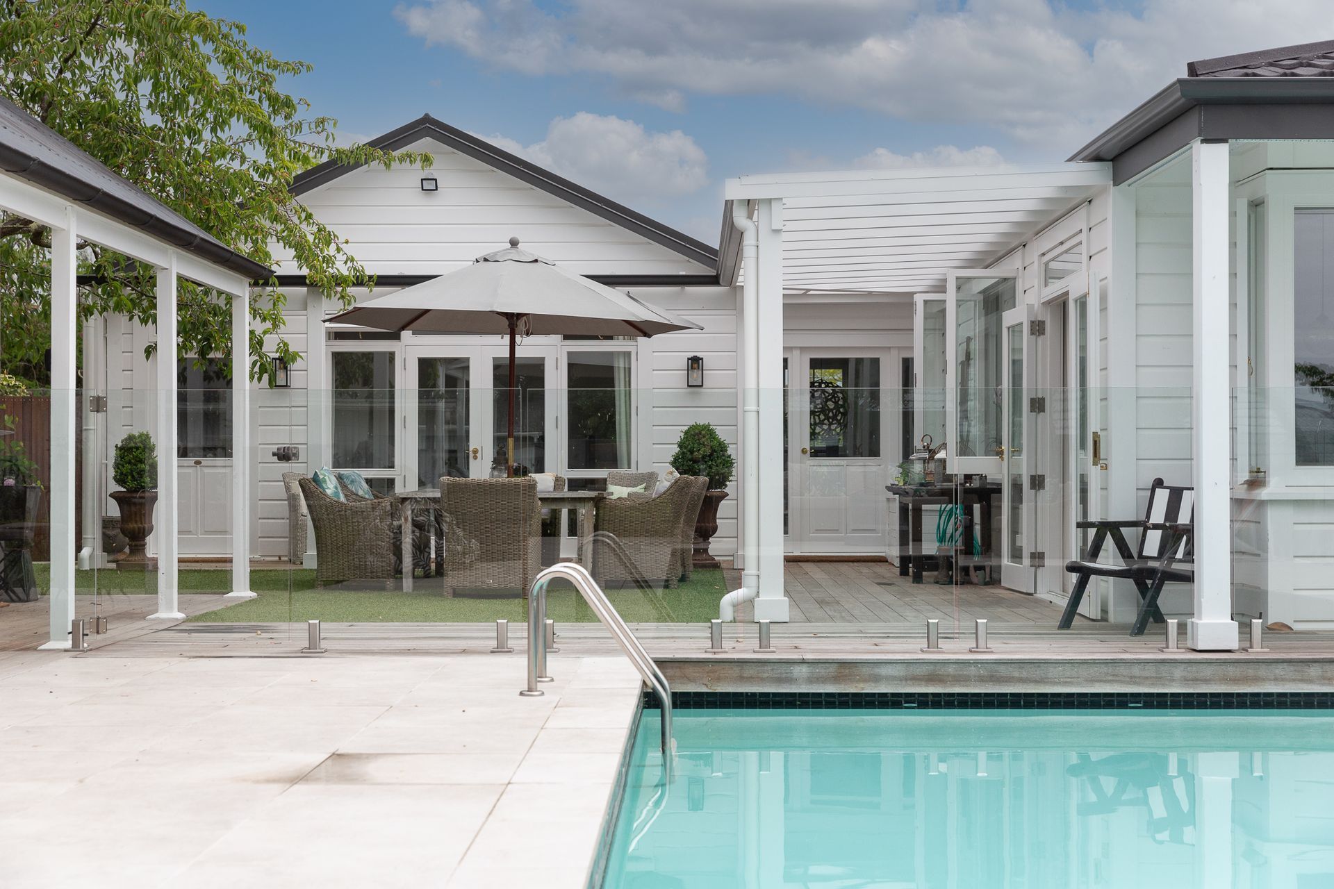 Bi folding kitchen windows allow easy access to the kitchen for a cool drink or platter of nibbles.
