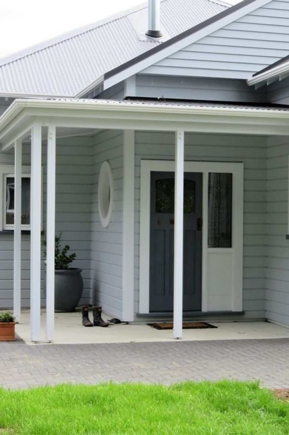 Entrance to the home showing the wooden window framing
