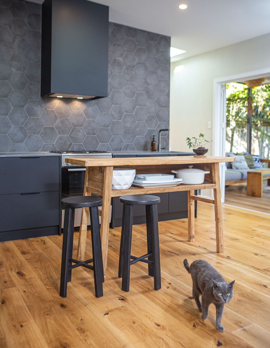 The heart of the home, where all other spaces converge, and where everyone comes together including the cat.