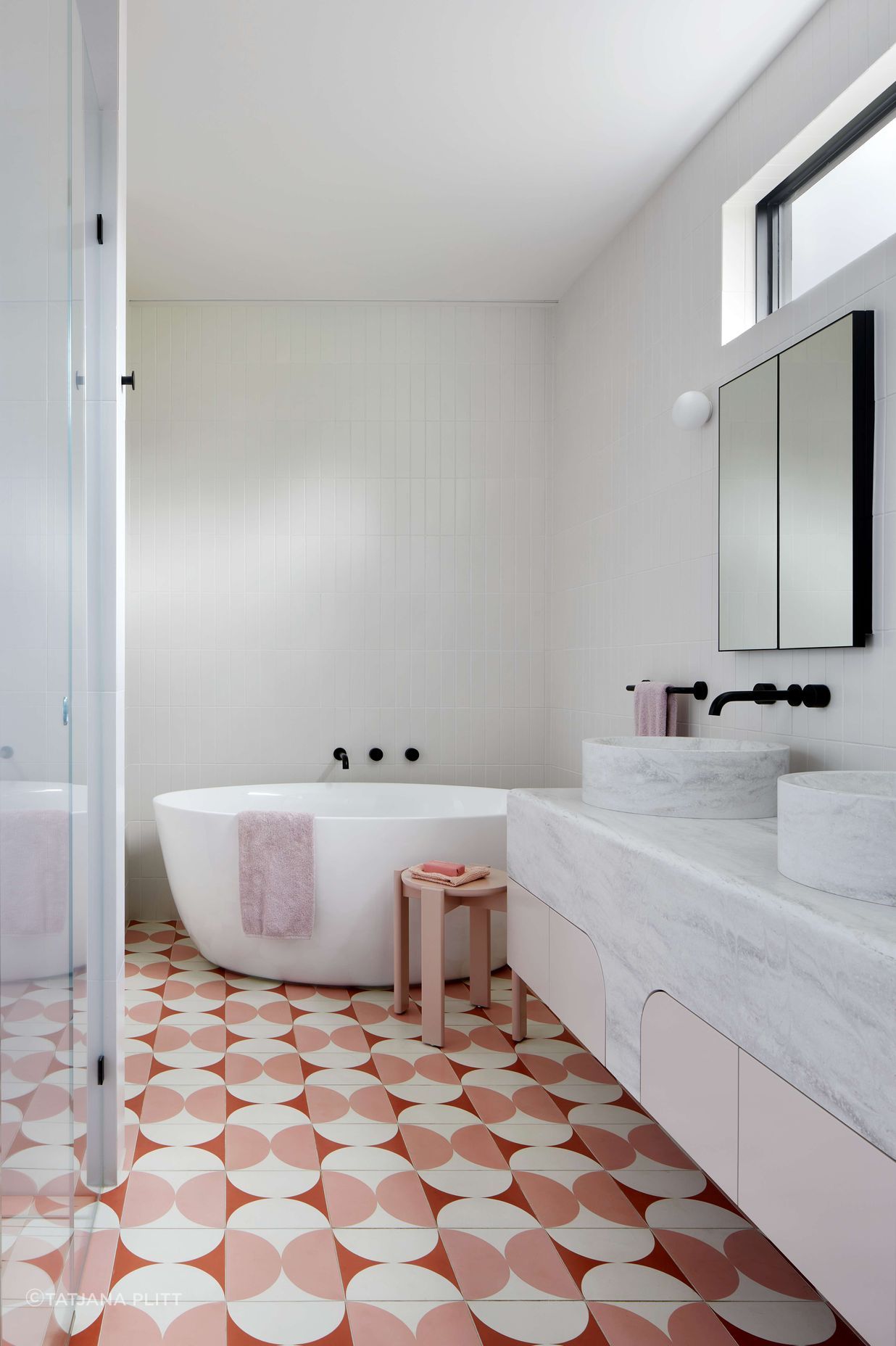 Art Deco inspired large ensuite bathroom with pink and cream Butterfly tile from Perini, featuring a top mounted, double sink from corian, Forme L'isola  Freestanding Bath  and walk in shower.   Located in Melbourne, see more from our Arch Deco Project. The colour scheme references the colours used commonly during the Art Deco period of the house.