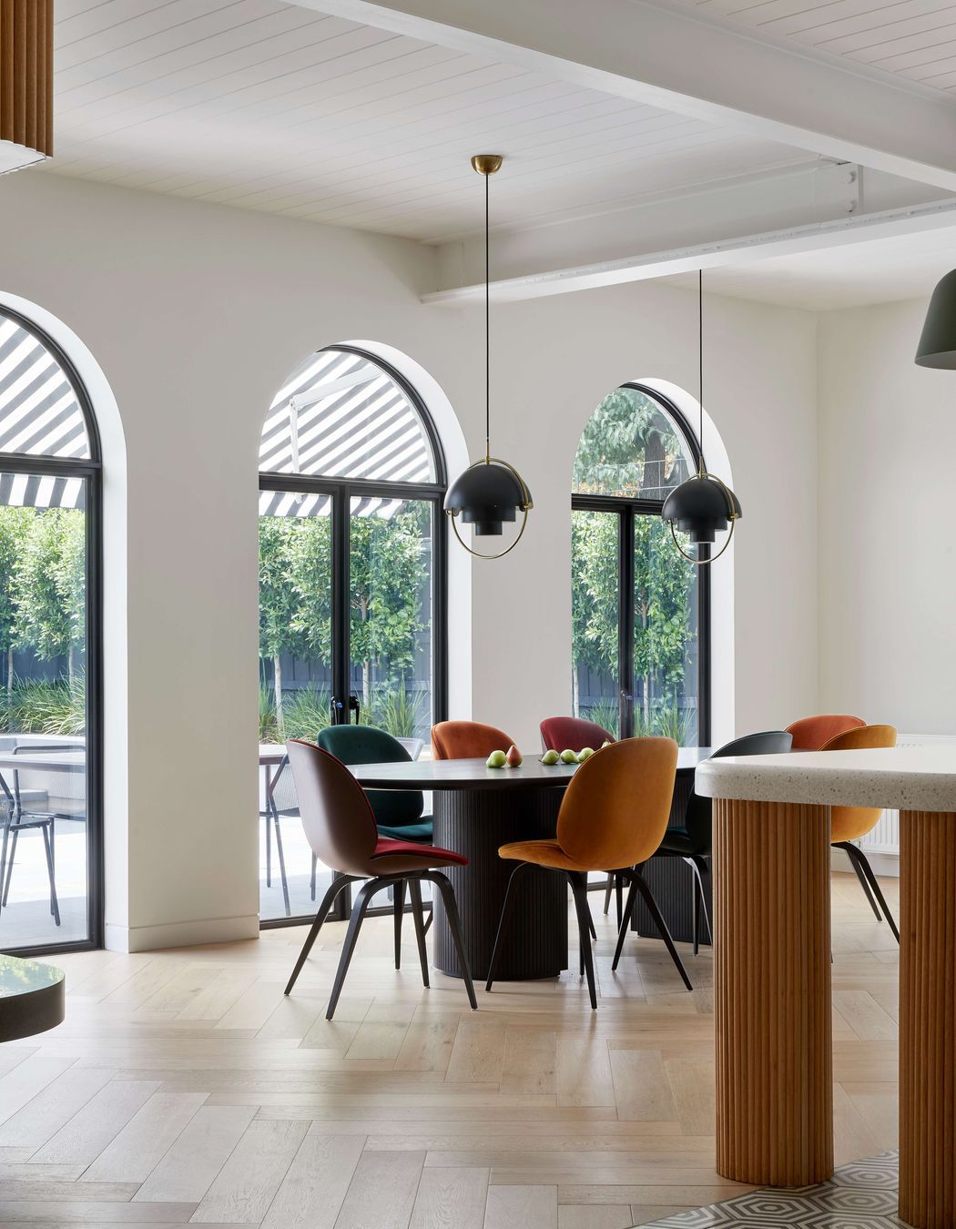 Modern inspired dining room in open plan kitchen, featuring flooring in pale oak in a herringbone pattern from Havwoods, a nod to the art deco period of the home. Located in Melbourne, see more from our Arch Deco Project