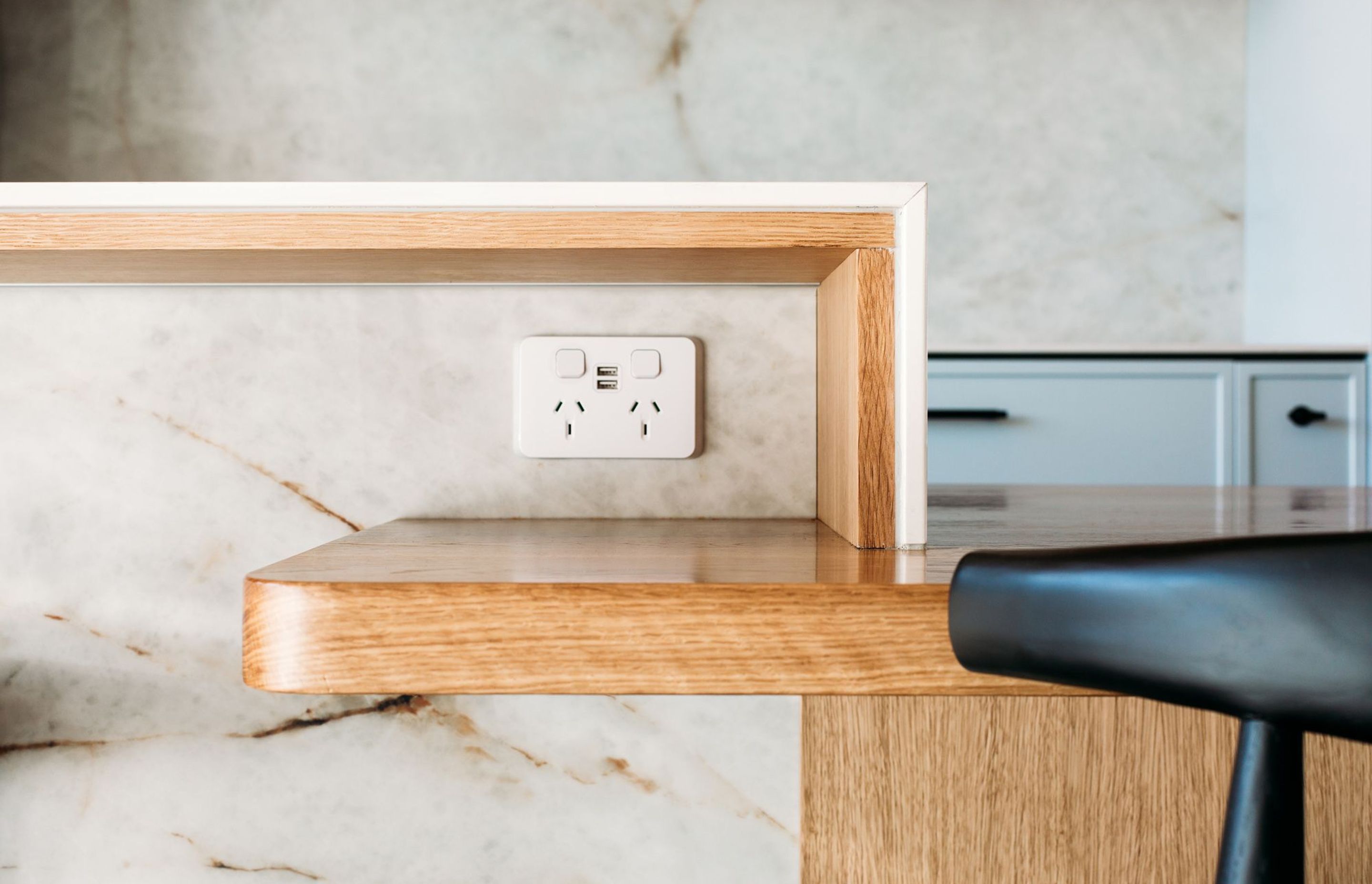 This solid oak shelf is a tidy nook to house charging phones, the pen box and the shopping list.