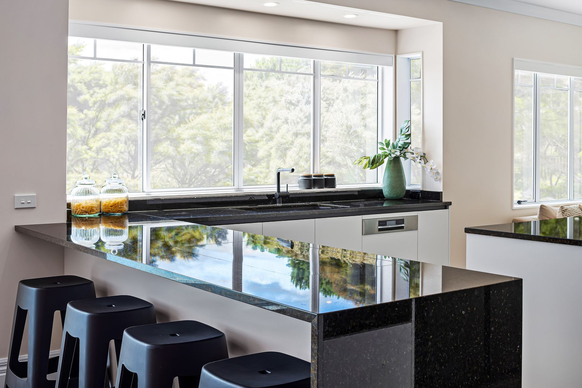 flush mounted cooktop detail on natural granite Verde Bahia