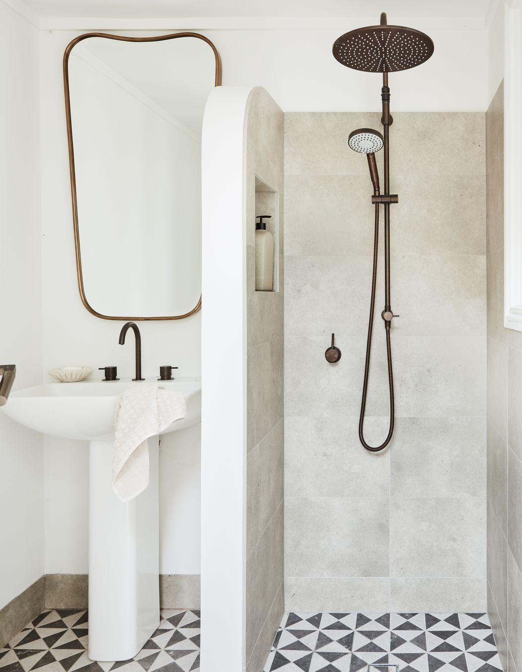 POOL AREA BATHROOM Windmill mosaic floor tiles, Tilecraft. Gage mirror, Made Goods. Brodware ‘Minim’ basin set, ‘City Plus’ shower set and Duravit ‘ME’ pedestal basin, all Sydney Tap and Bathroomware