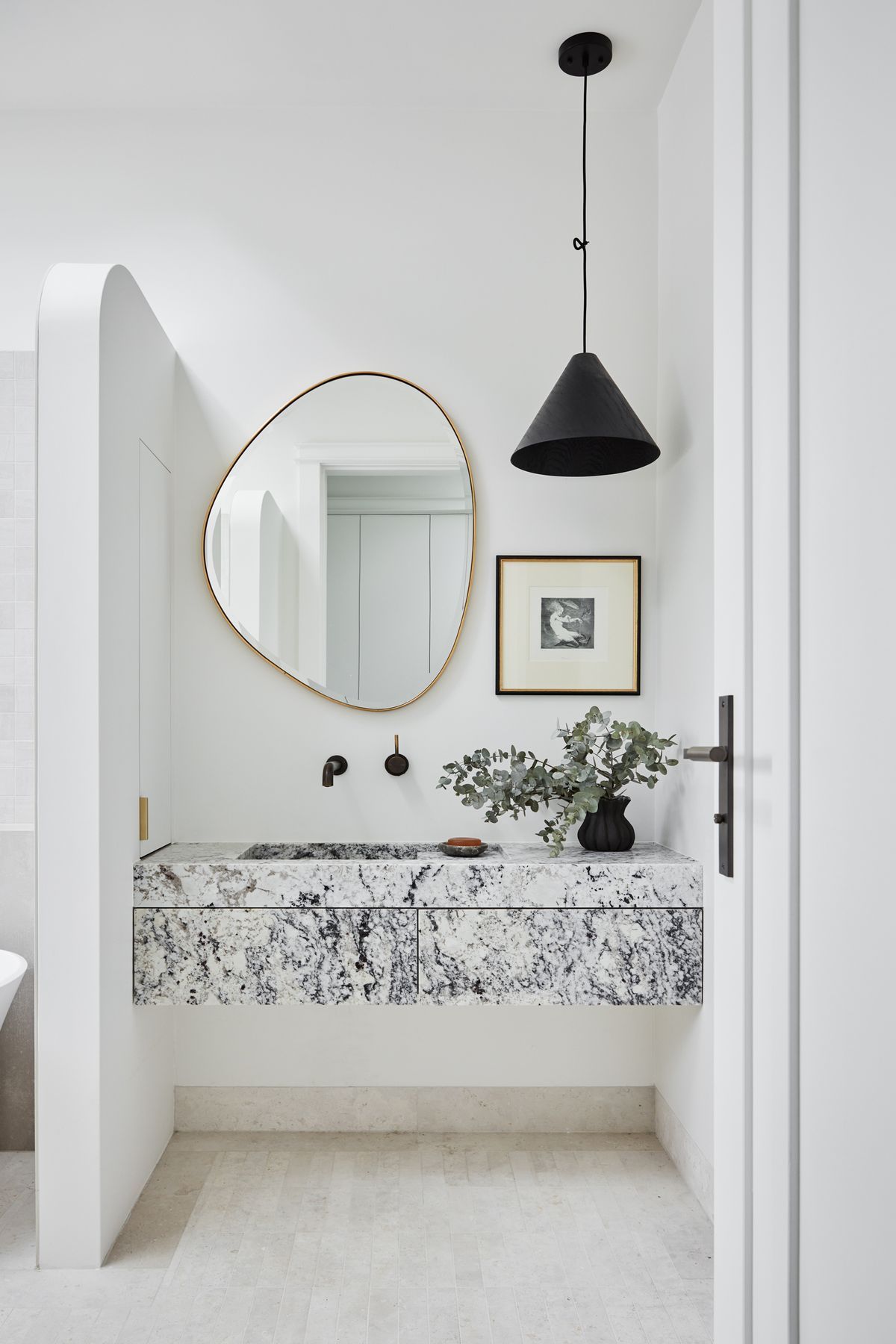 MAIN BATHROOM Summit 330 pendant light, About Space. Pebble mirror, Life Interiors. White granite vanity, Granite & Marble Works. Brodware ‘City Stik’ wall mixer, Sydney Tap and Bathroomware. Limestone floor tiles, Onsite Supply+Design. Boost wall tiles, Rocks On.