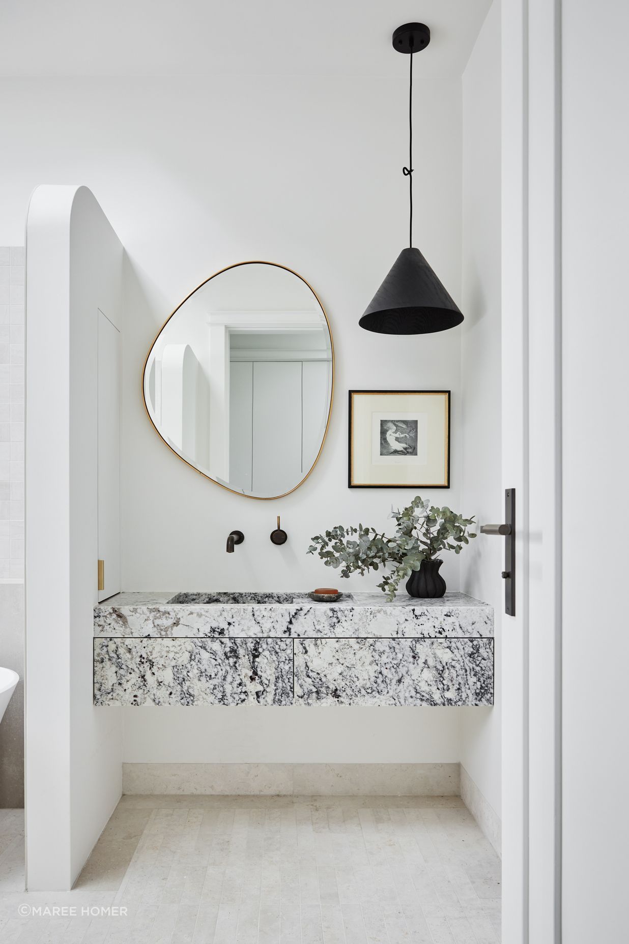 MAIN BATHROOM Summit 330 pendant light, About Space. Pebble mirror, Life Interiors. White granite vanity, Granite &amp; Marble Works. Brodware ‘City Stik’ wall mixer, Sydney Tap and Bathroomware. Limestone floor tiles, Onsite Supply+Design. Boost wall tiles, Rocks On.
