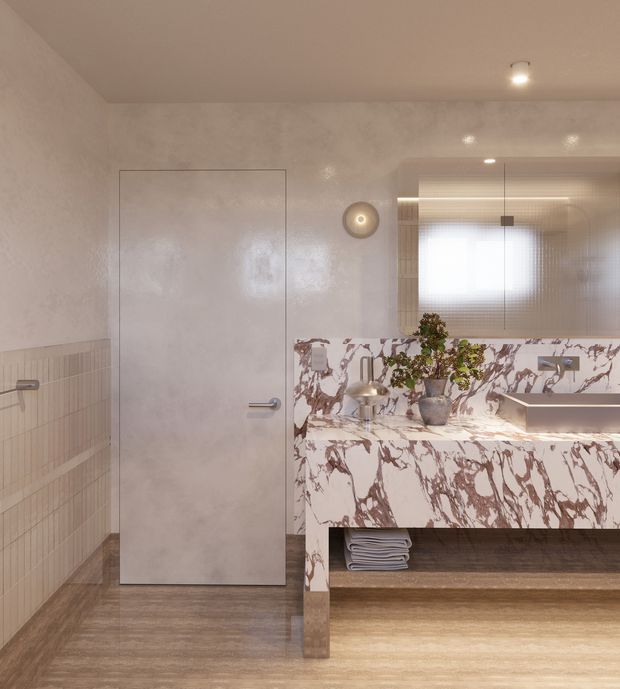 A refined contemporary bathroom featuring a wall-mounted double vanity clad in dramatic white marble with burgundy veining, a large integrated mirror, warm recessed lighting, pale textured wall finishes, vertically tiled lower walls, and a timber-look floor. A frameless door and concealed storage contribute to the clean, luxurious design.
