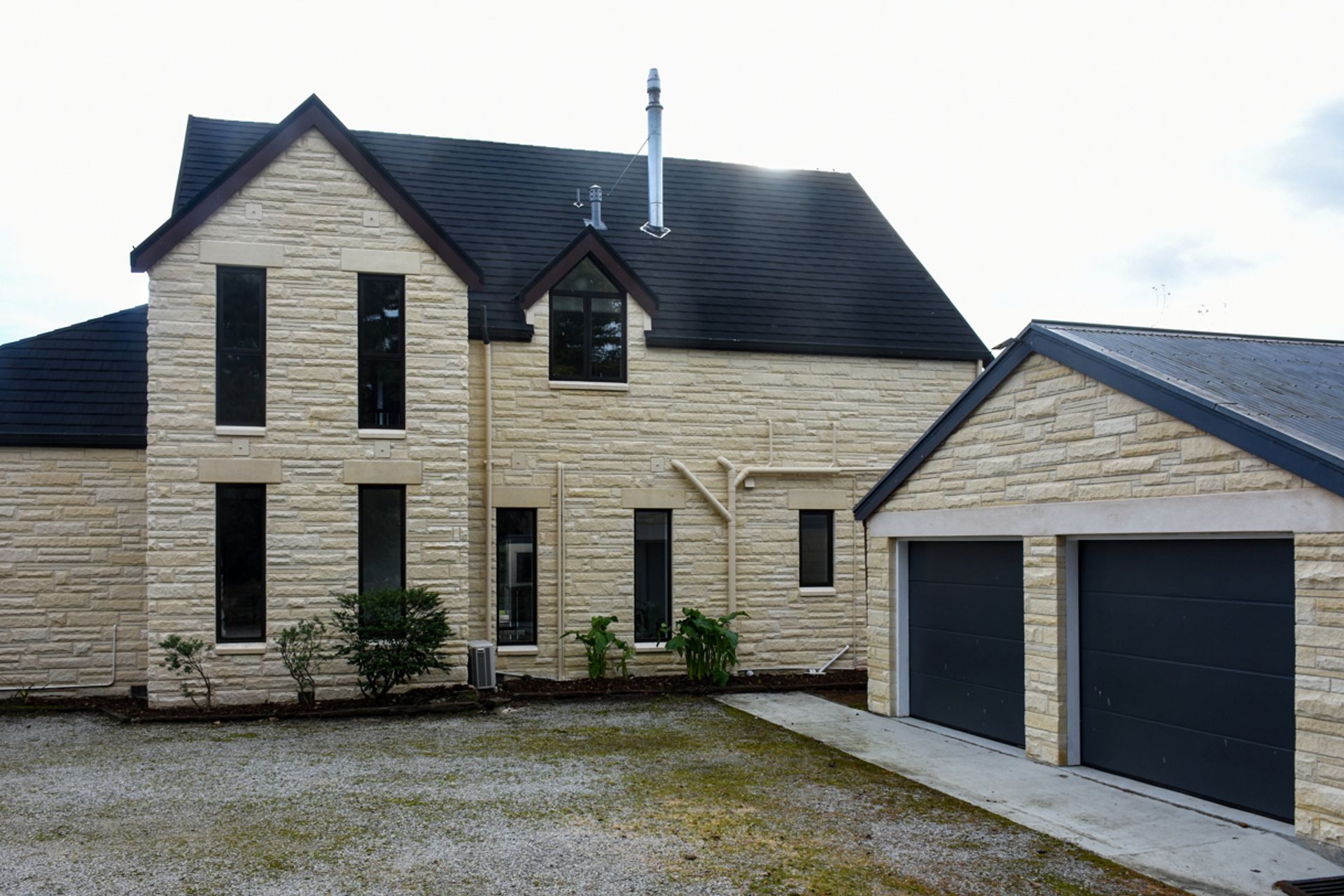 Courtyard - New roofing with slate alternative [ Metrotile Textured CF Slate Tile], double-glazed windows, bargeboards, restoration/cleaning of Oamaru stone