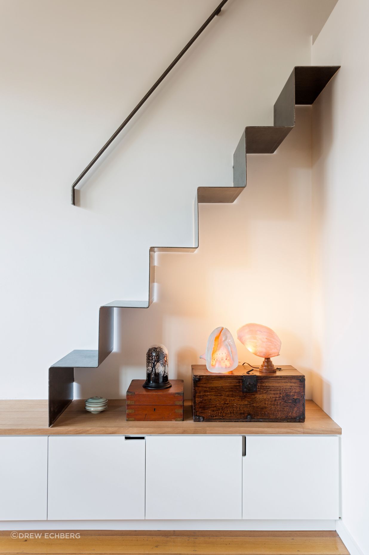 A folded metal stair gives good access to a storage area