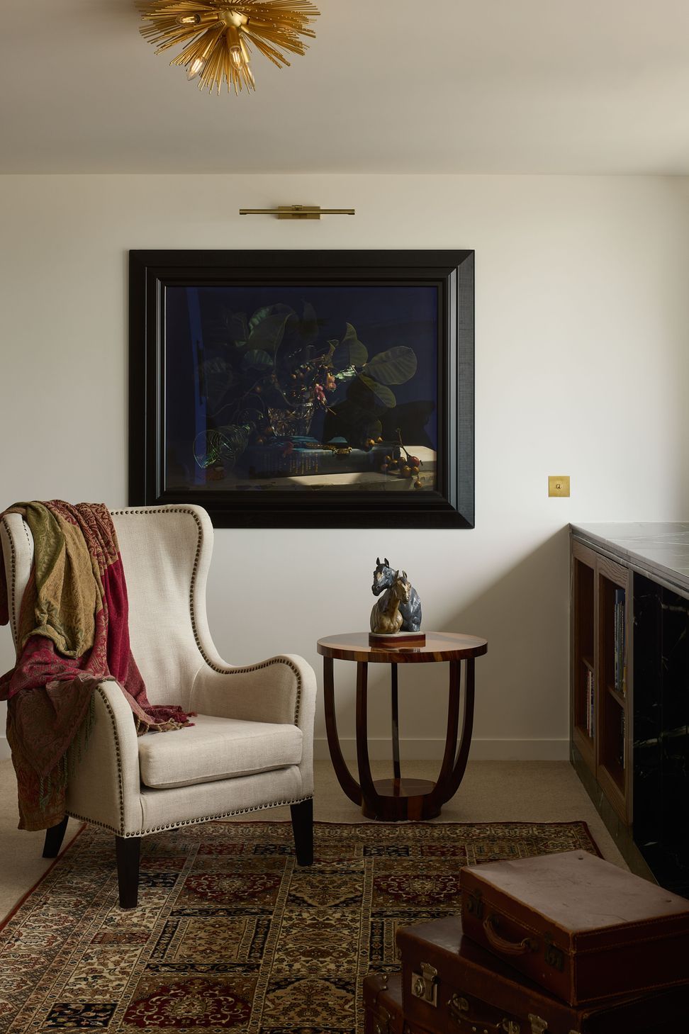 The living area at The High Life blends old and new — vintage pieces sit alongside bespoke joinery in this refined Queen Street apartment by Rogan Nash Architects.