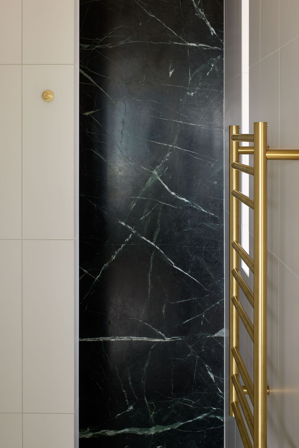 Classic fittings and understated elegance define the bathroom at The High Life, a Queen Street apartment refurbishment by Rogan Nash Architects.