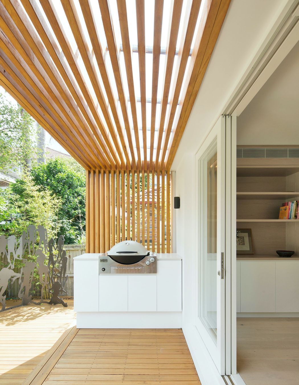 The rear verandah becomes an extension of the interior with continued joinery and timber linings.