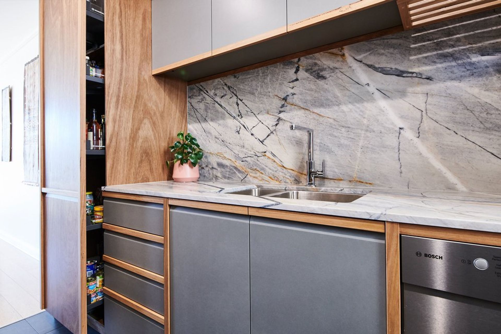 Solid Blackbutt handles and vertical partitions are a contemporary take on traditional frame and panel doors.