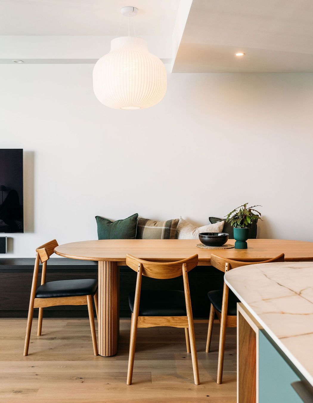 The pendant perfectly hangs in sight line from the bedrooms, and over the dining table.