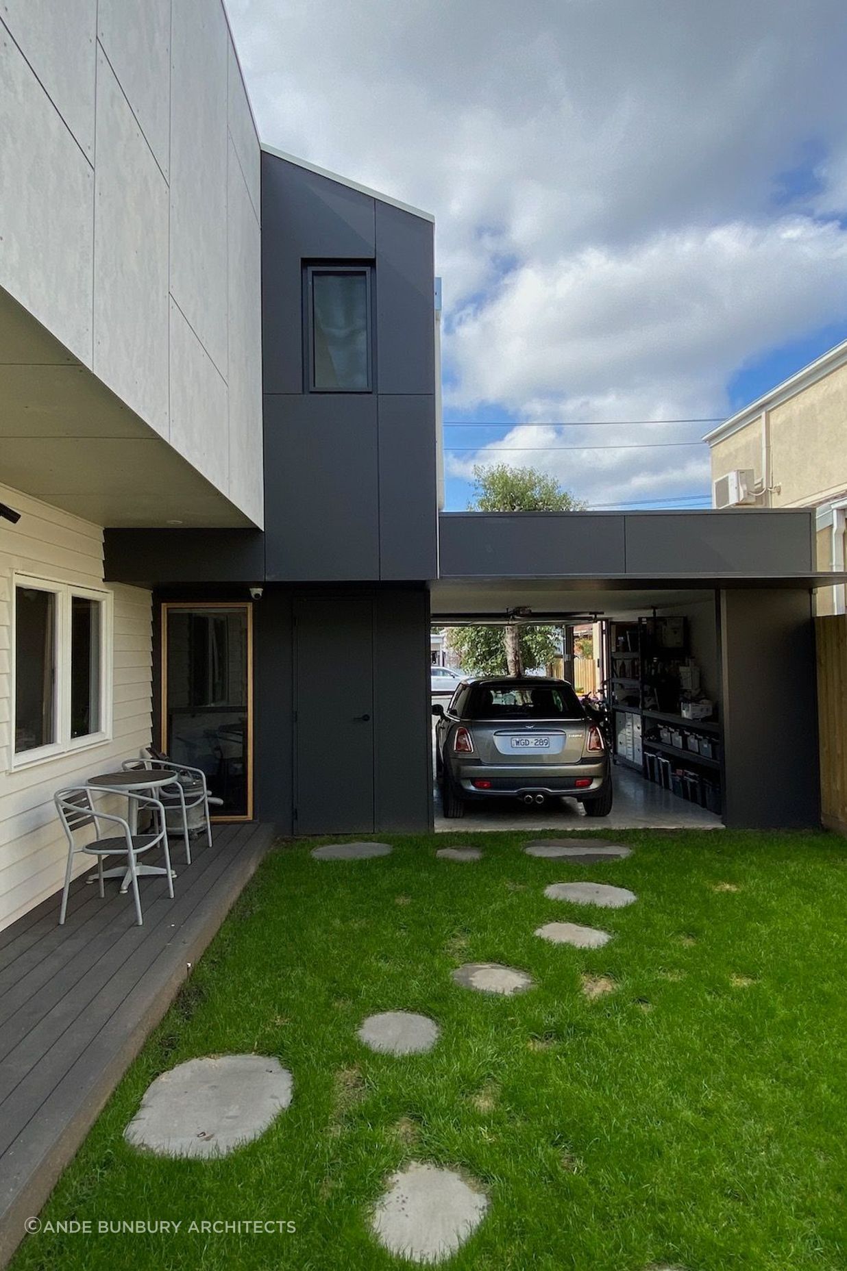 The garage provides privacy to the side garden and can be used as a space for entertaining