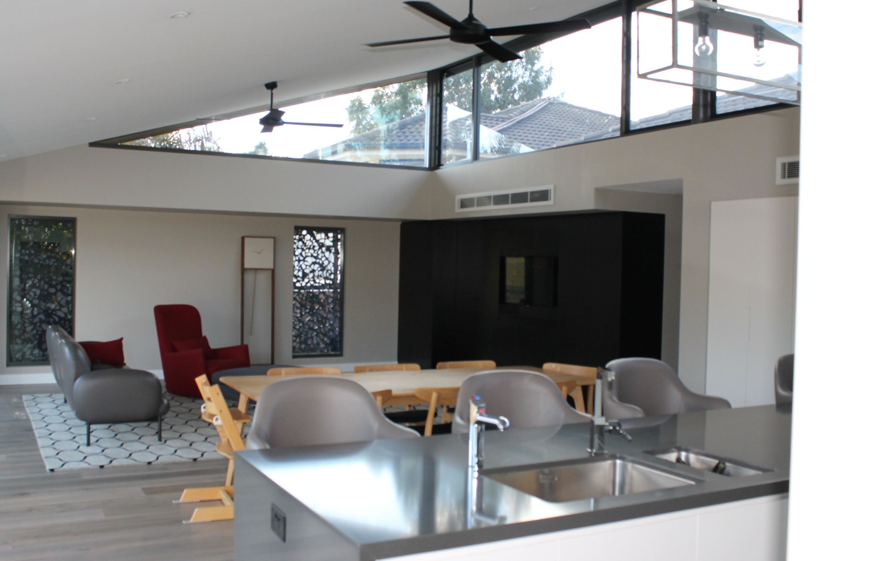 Kitchen, dining and living areas with high level glazing