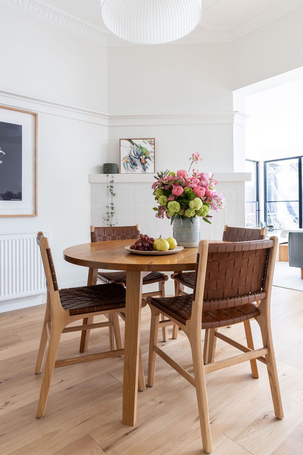 meals-area-with-round-table-pendant-light-and-fireplace.jpg