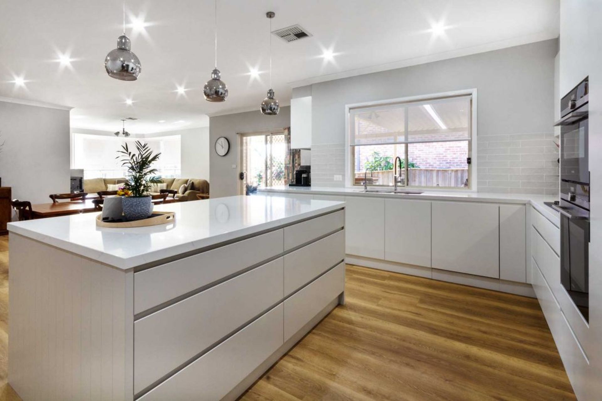 modern-kitchen-design-sydney-white-kitchen-bosch-fisher-paykel-dulux-silestone-siemens-zip-tap-6-1084x716.jpg