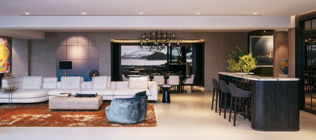 A spacious open-plan contemporary living and entertaining area with a white sectional sofa, low ottoman, sculptural lounge chair, dining table, and a curved dark bar island with stools. The room features a warm wood floor, a large patterned rust-toned rug, dark built-in cabinetry, a dramatic arched wall feature, full-height glazing, and a linear chandelier over the dining area.