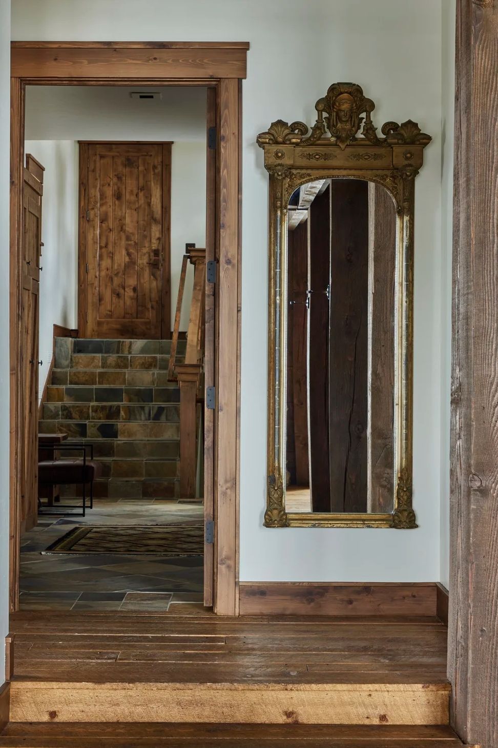 rustic-mountain-home-hallway-wood-trim-antique-mirrorwebp-ap-compressed-v3.jpg