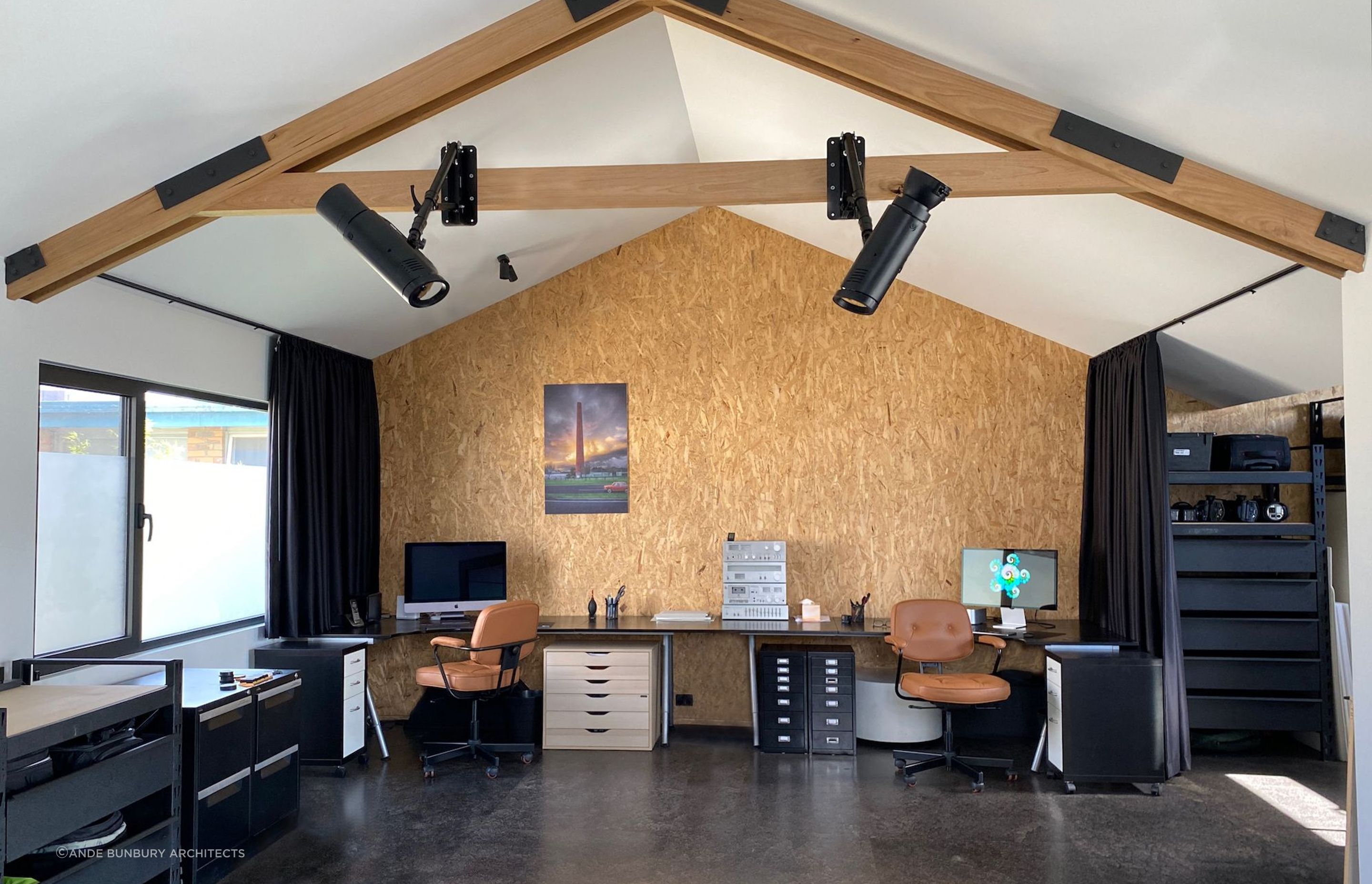 Photography studio with exposed structural insulated panel walls