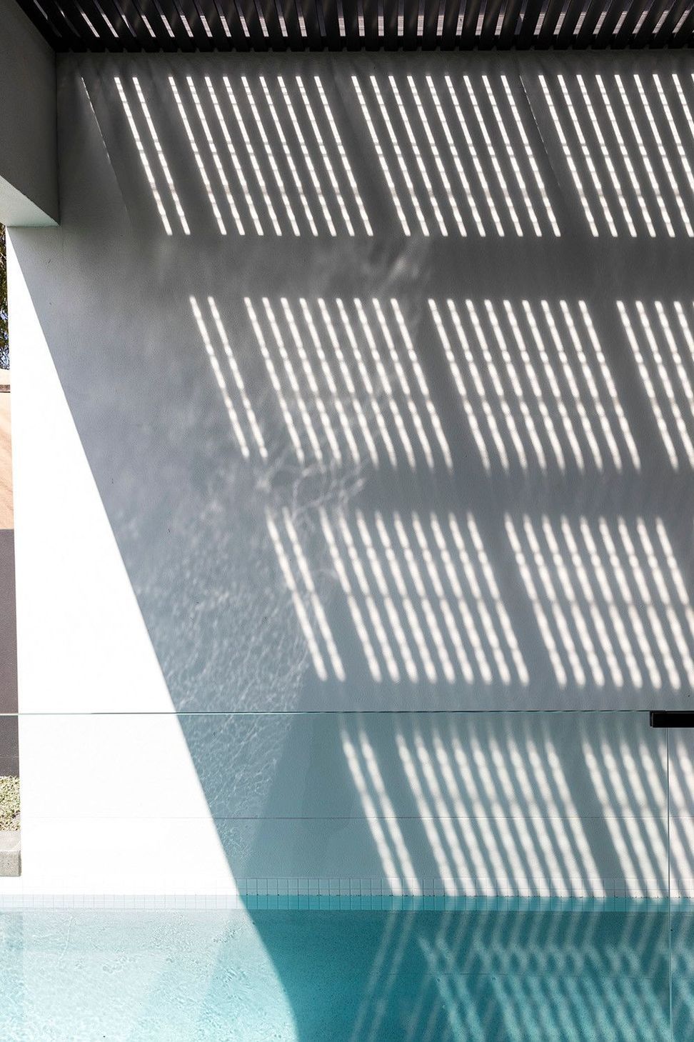 Morrison Residence - Exterior. Striped shadows falling across a white wall.