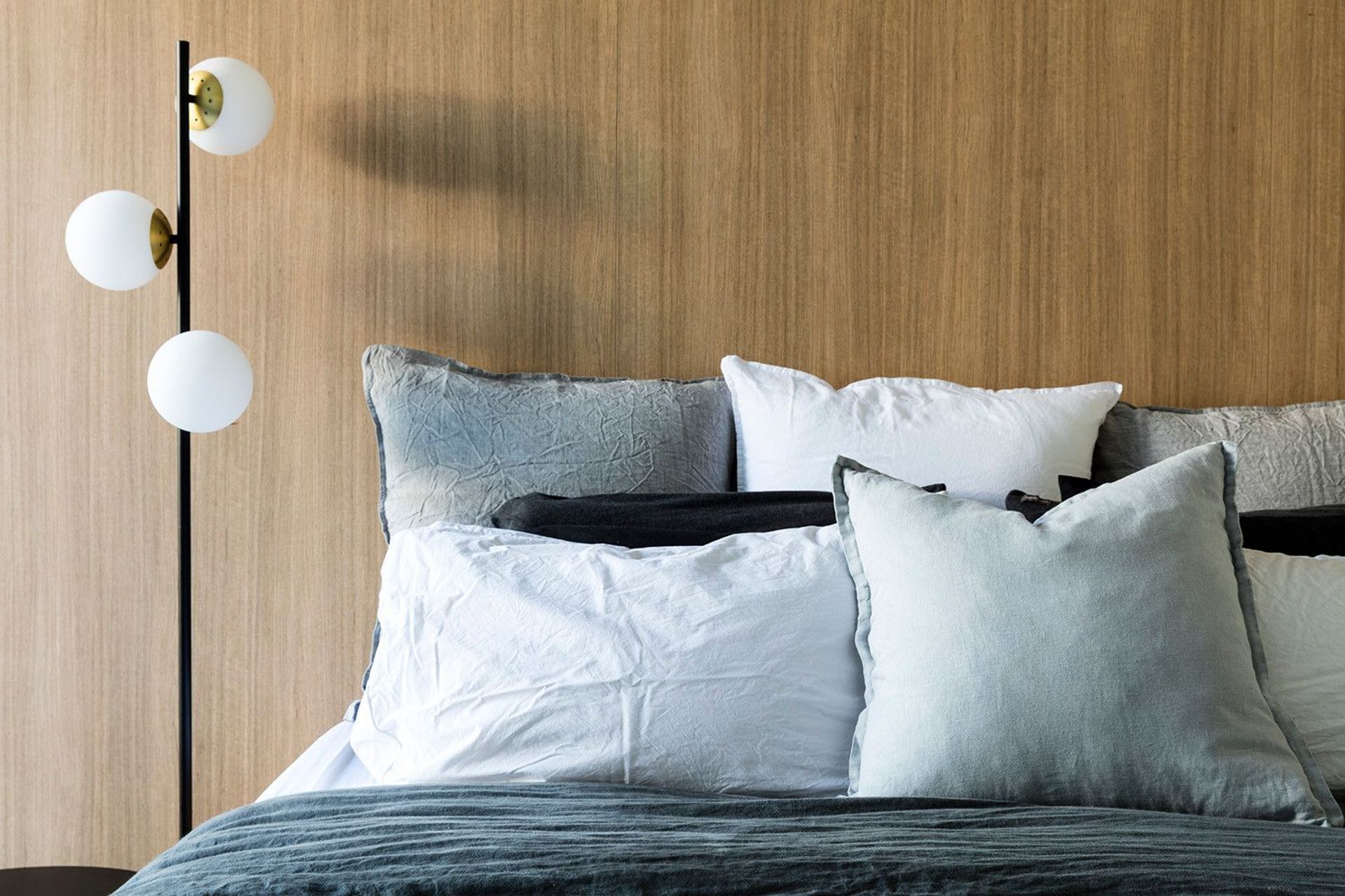 Morrison Residence - Bedroom. Timber bedhead and globe wall lights.