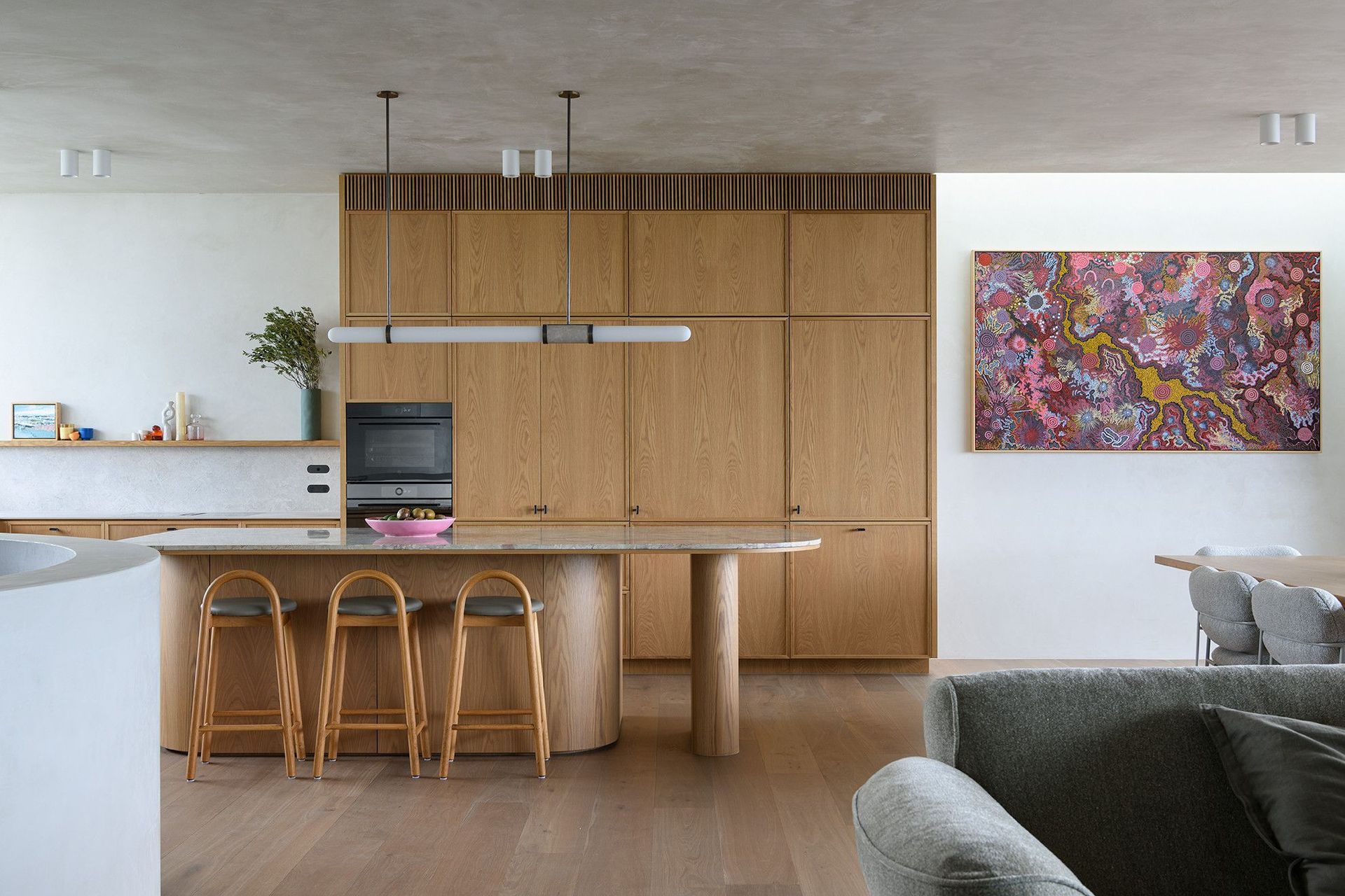 Villa Solare - Kitchen. Timber kitchen and stone island with leather stools.
