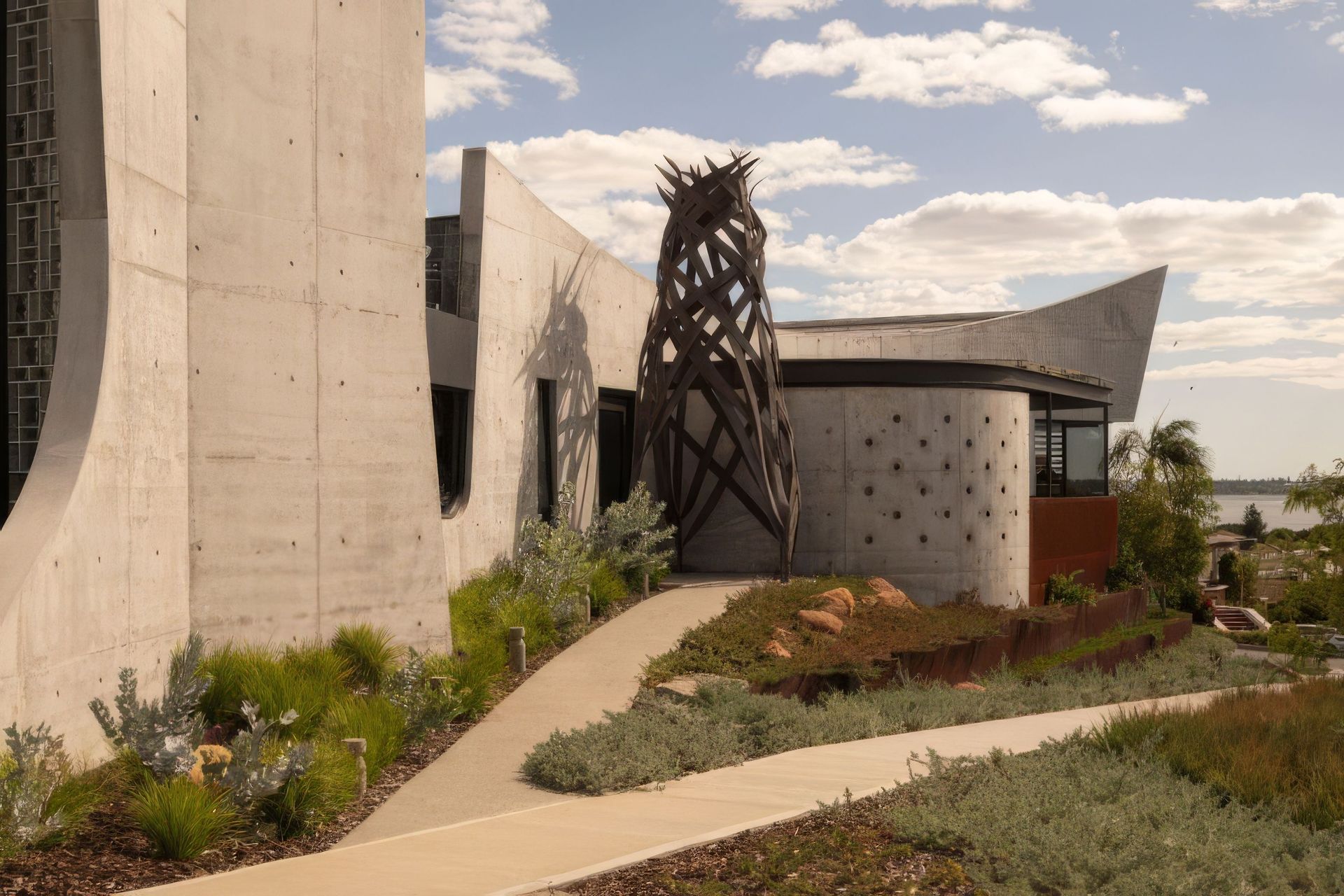 Exterior-view-with-sculpture-DR-Bat-Cave-767x511-upscaled-by-Replicate.jpg