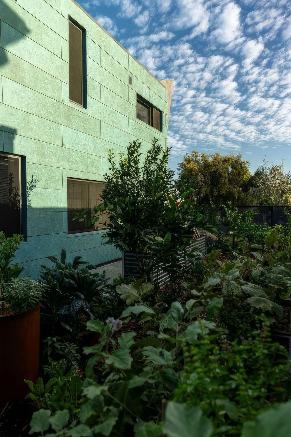 Exterior-with-veggie-garden-RT-Bat-Cave-1-511x767-upscaled-by-Replicate.jpg