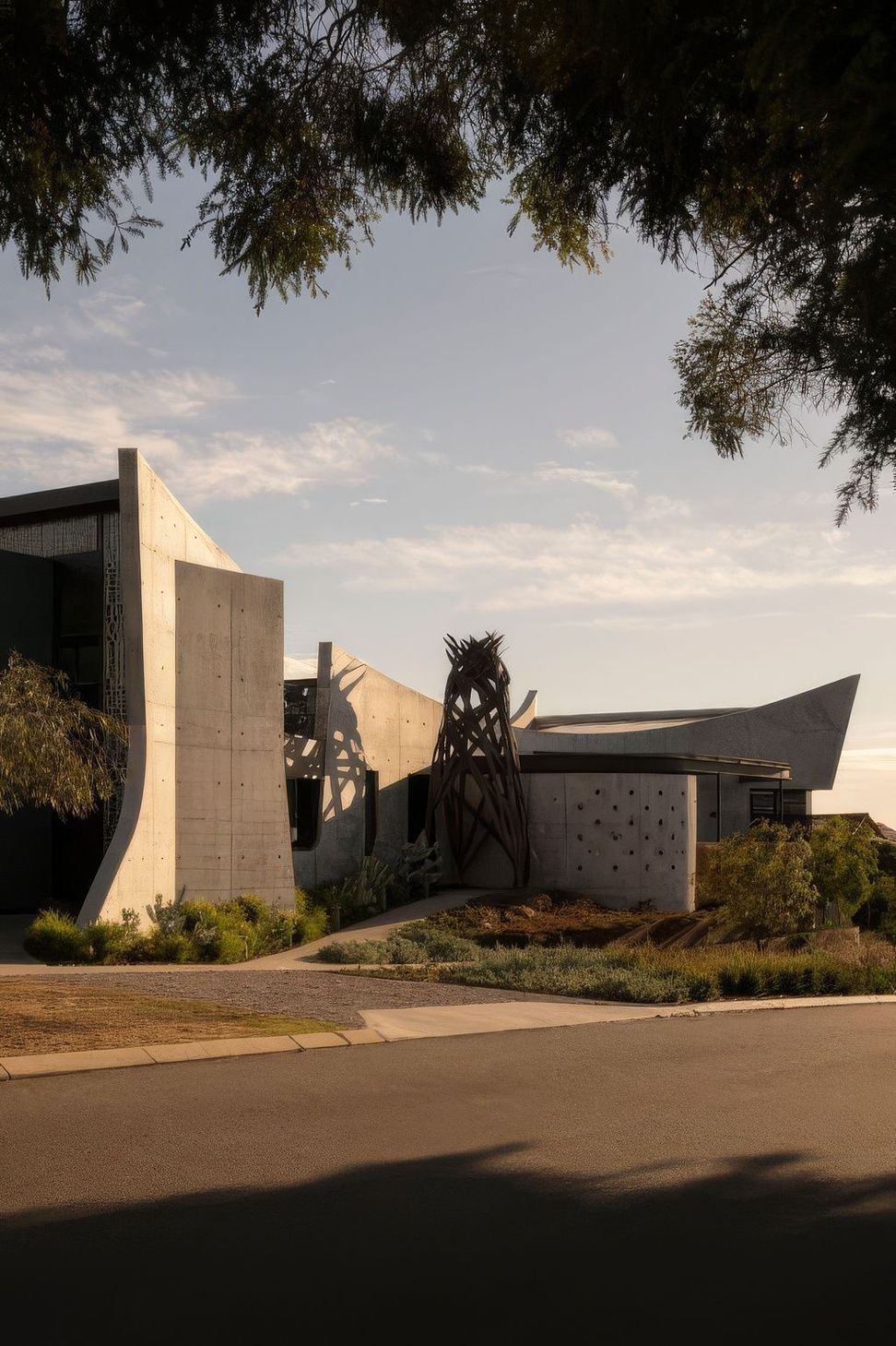 Rear-side-street-view-with-sculpture-DR-Bat-Cave-511x767-upscaled-by-Replicate.jpg