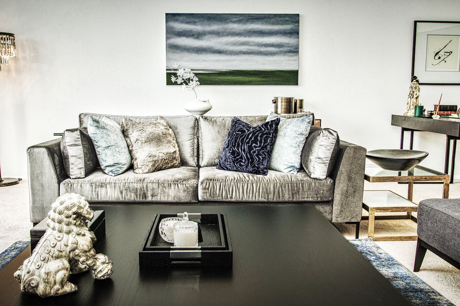 Lighting by Jeremy Cole. Cushions and throws by Mokum and Furtex. Paintings by artists Donna North and Margaret Woolley.