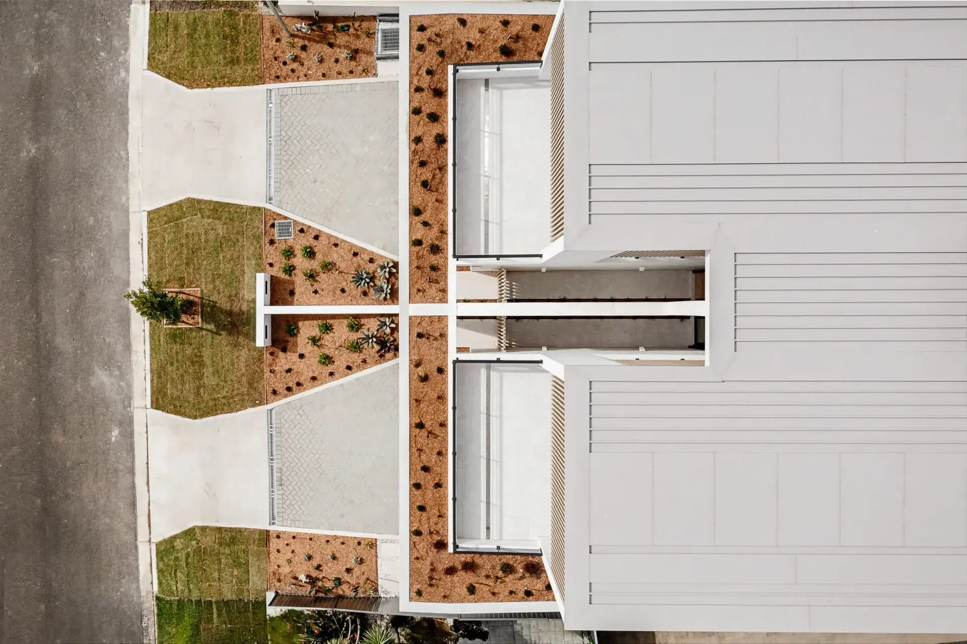 obrien-duplex-bulli-aerial-plan-symmetry-driveway-terrace-light-and-lines.webp